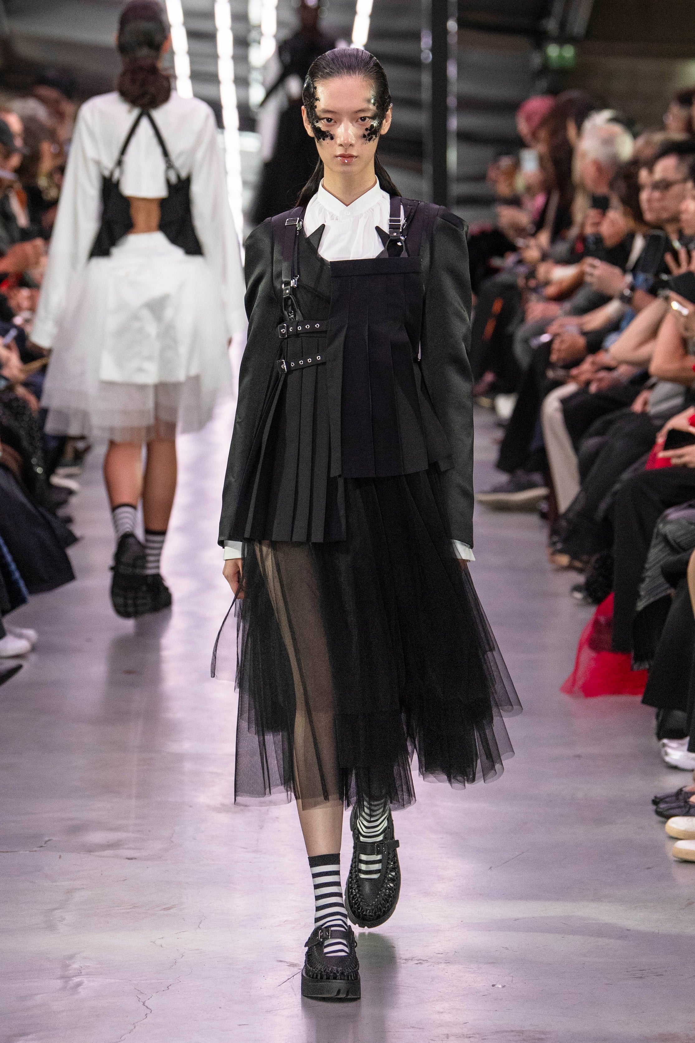 Fashion model wearing a noir kei ninomiya SS24 outfit