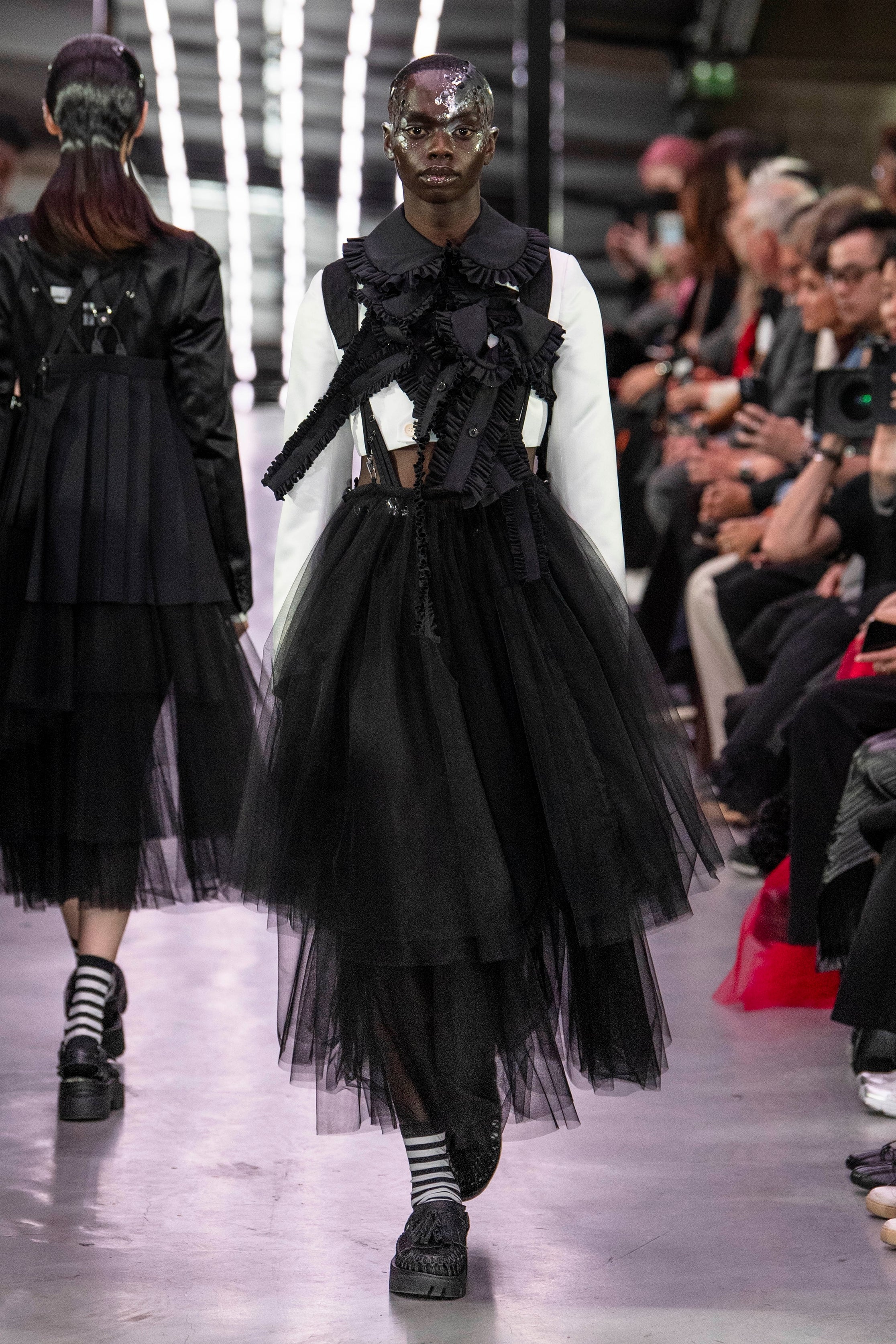 Fashion model wearing a noir kei ninomiya SS24 outfit