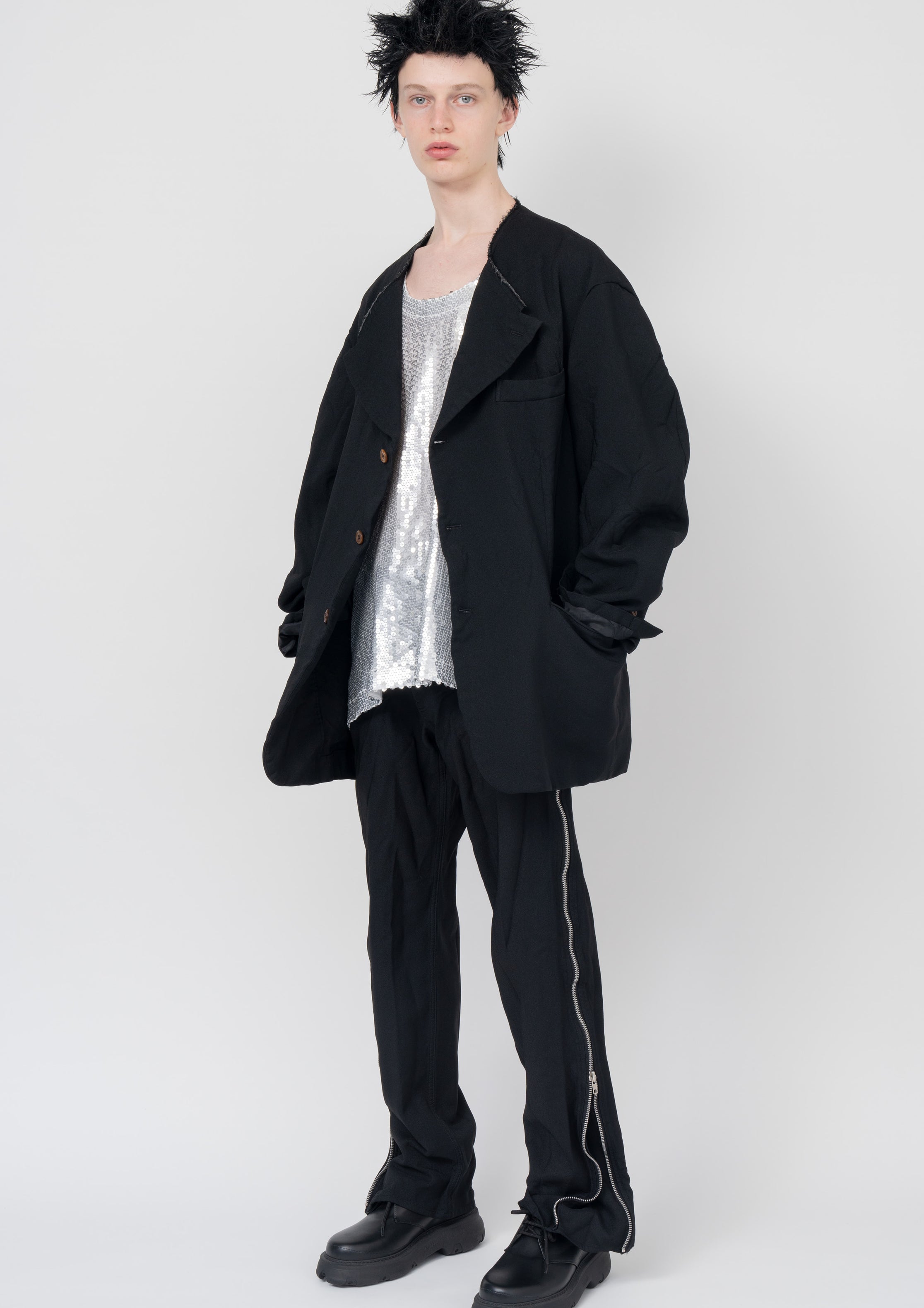 Fashion model wearing a Black Comme des Garçons SS24 outfit