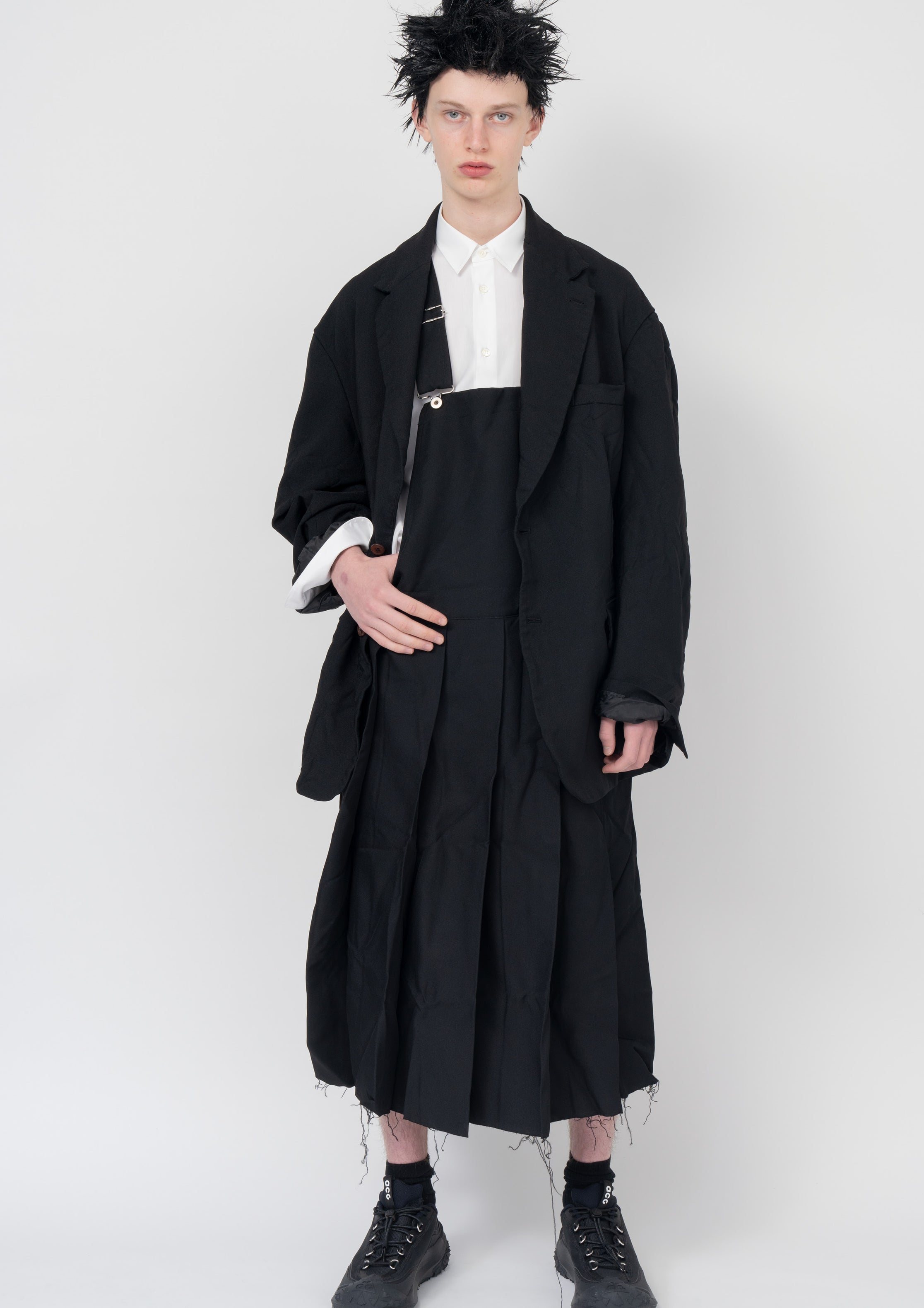 Fashion model wearing a Black Comme des Garçons AW23 outfit