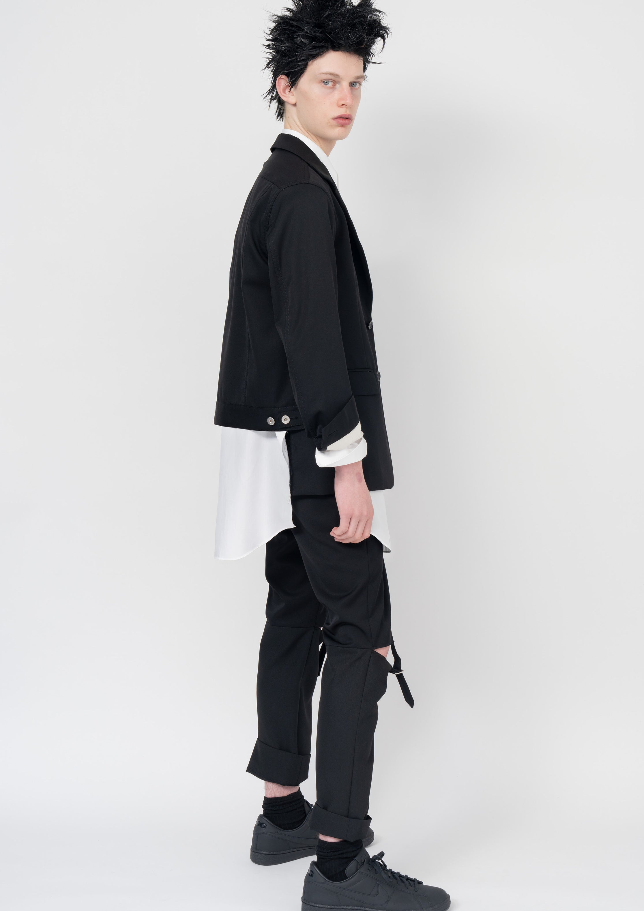 Fashion model wearing a Black Comme des Garçons AW23 outfit