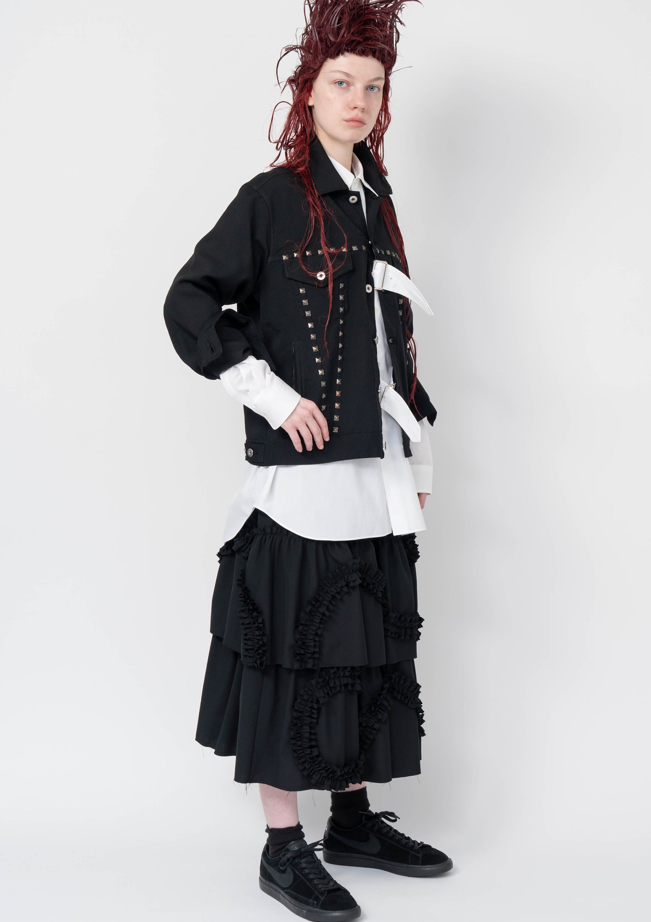 Fashion model wearing a Black Comme des Garçons AW25 outfit