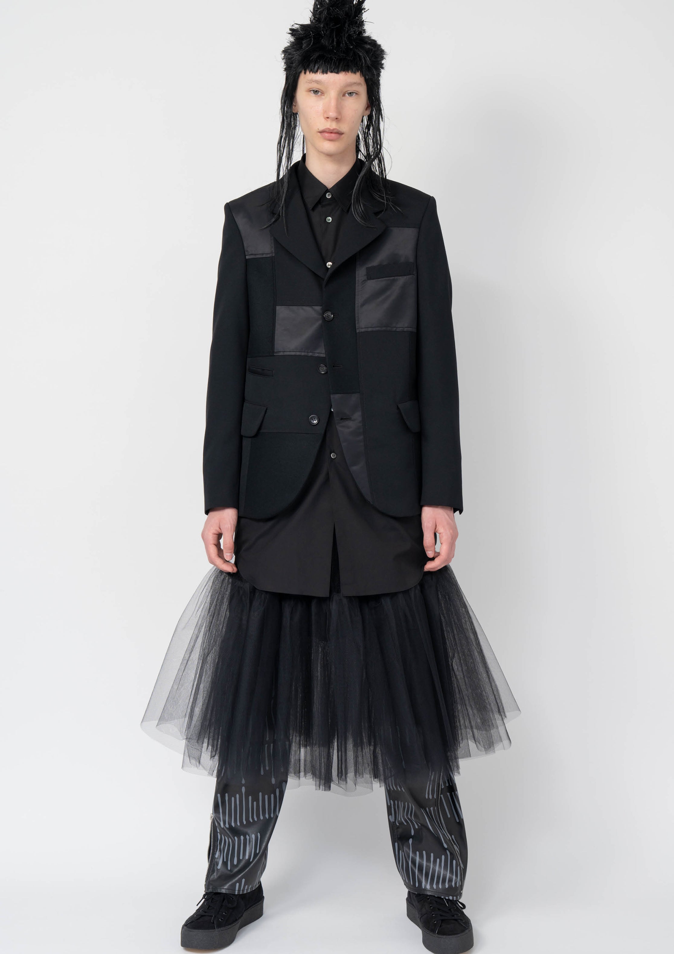 Fashion model wearing a Black Comme des Garçons AW25 outfit