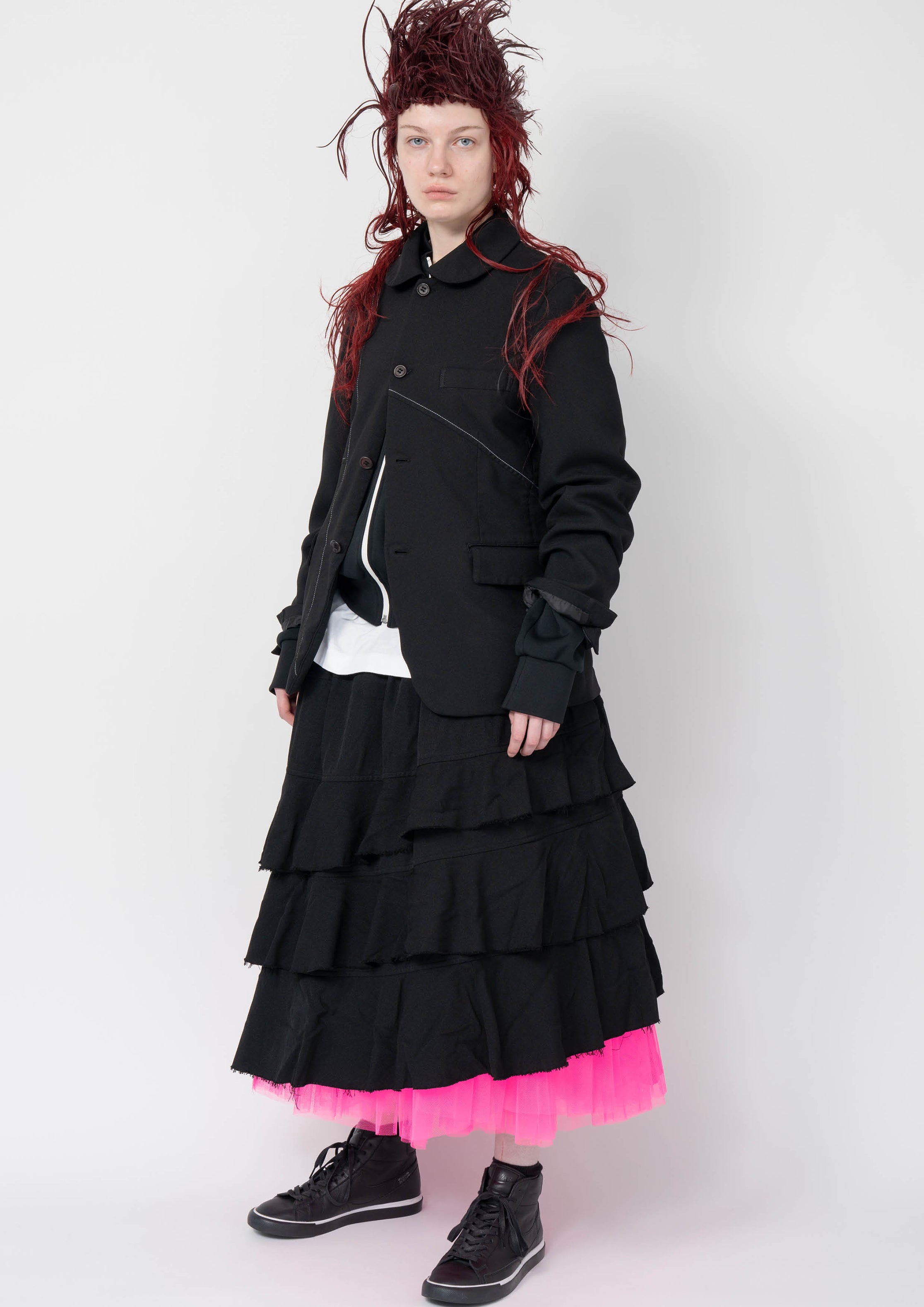 Fashion model wearing a Black Comme des Garçons AW25 outfit