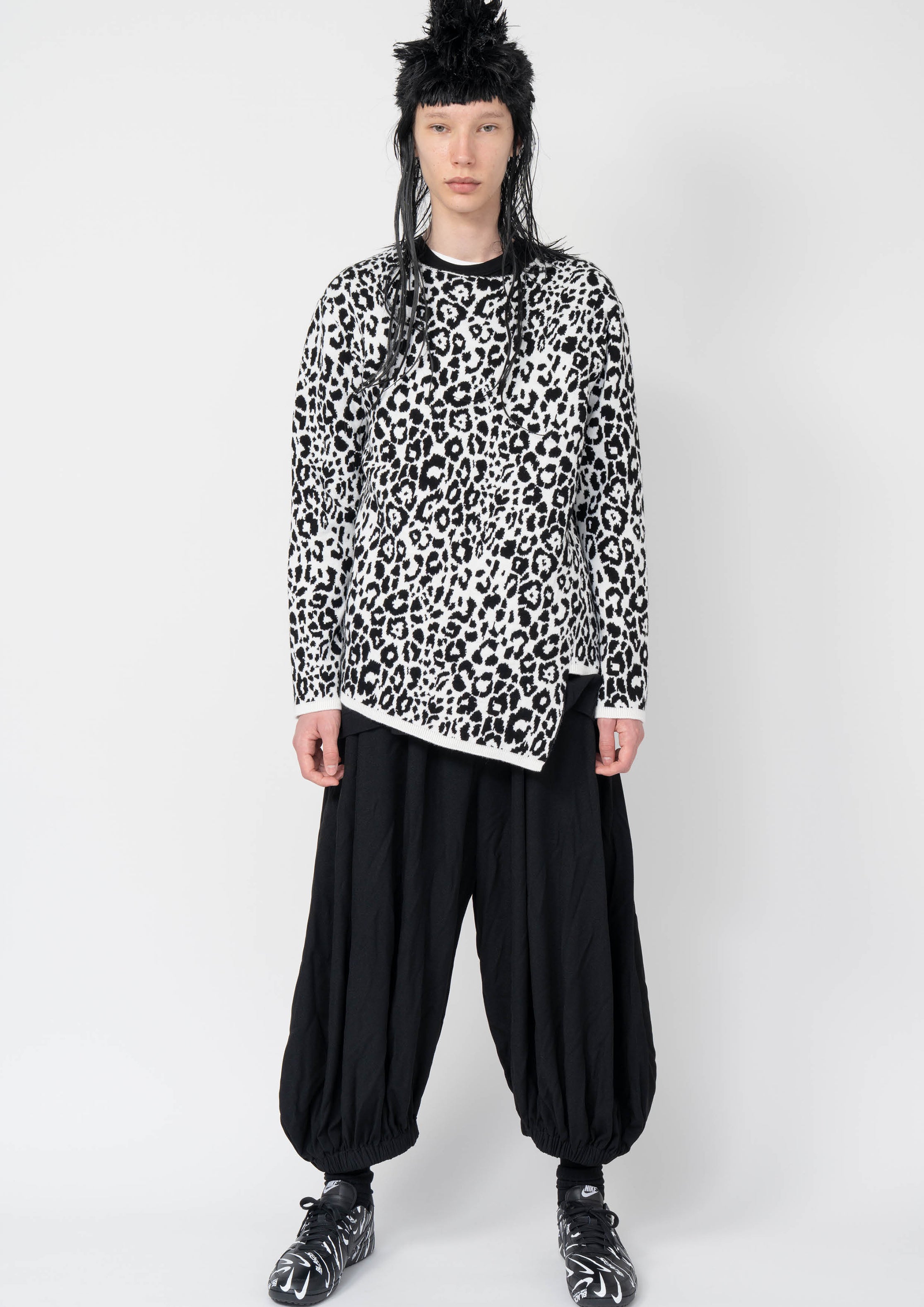 Fashion model wearing a Black Comme des Garçons AW25 outfit
