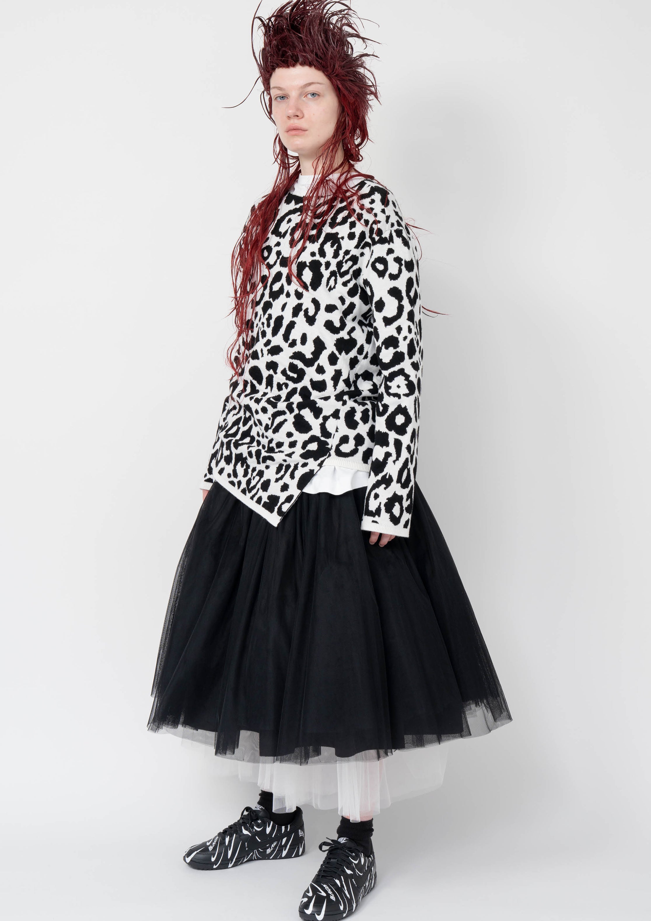 Fashion model wearing a Black Comme des Garçons AW25 outfit