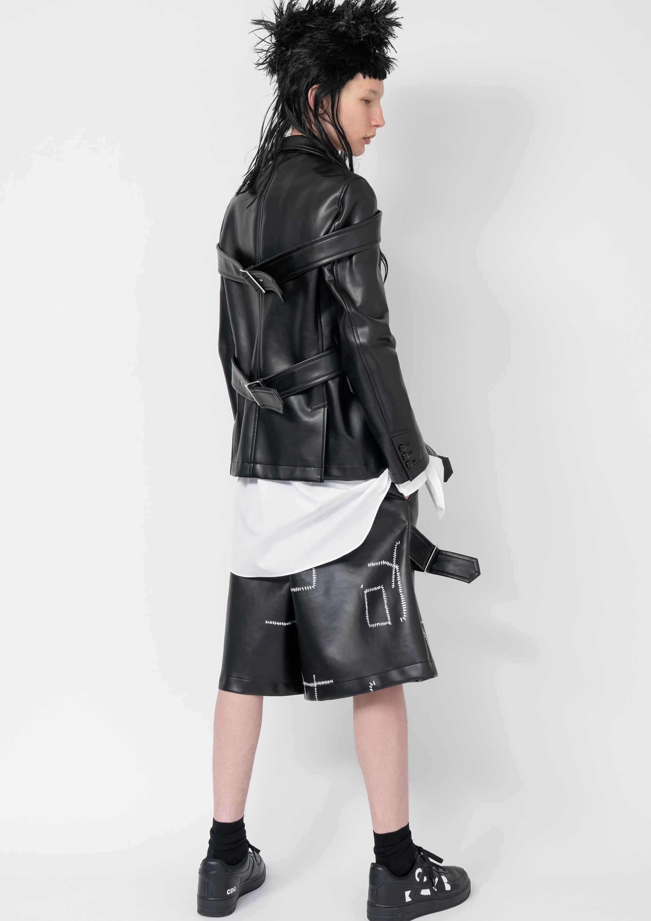 Fashion model wearing a Black Comme des Garçons AW25 outfit