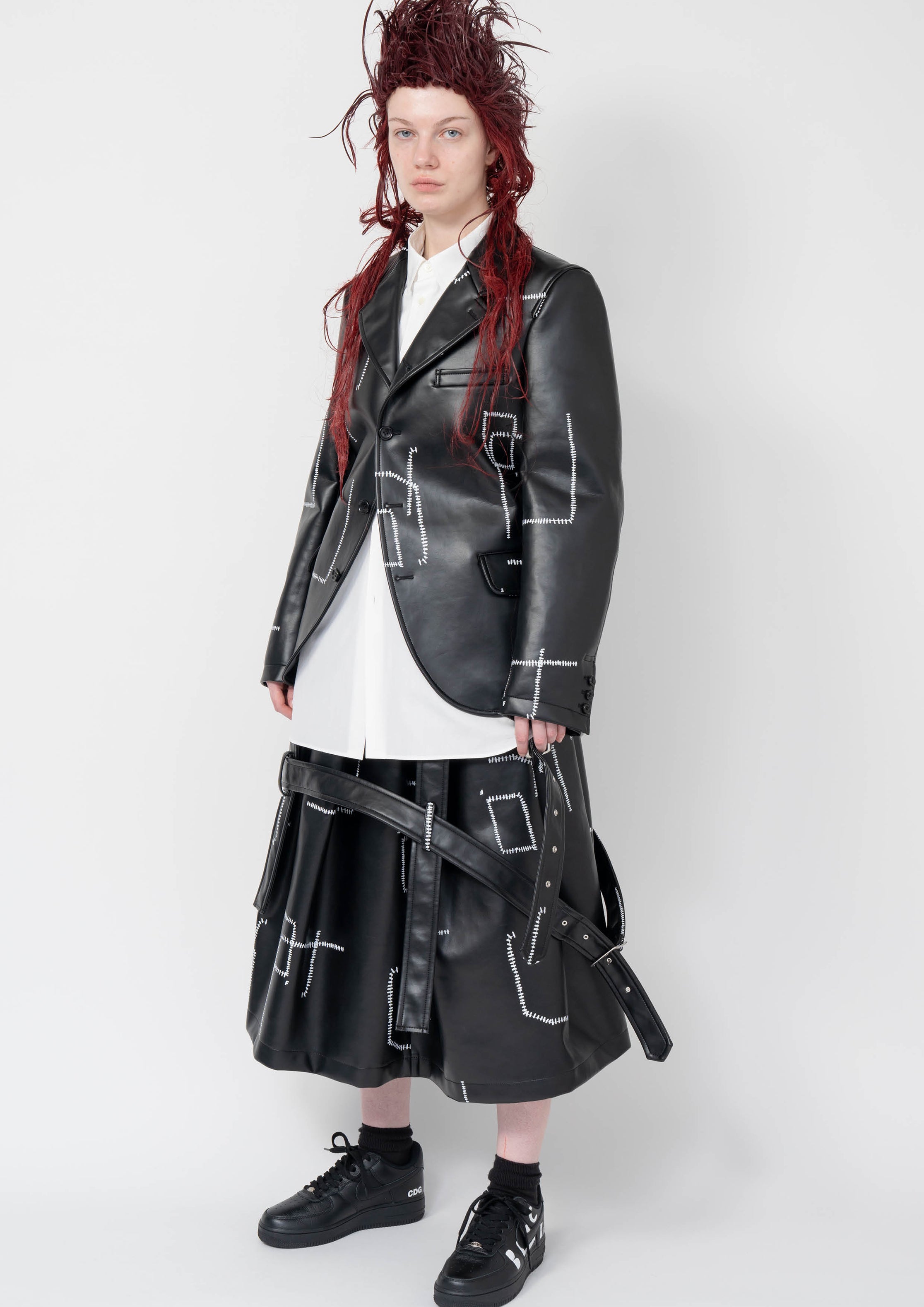 Fashion model wearing a Black Comme des Garçons AW25 outfit