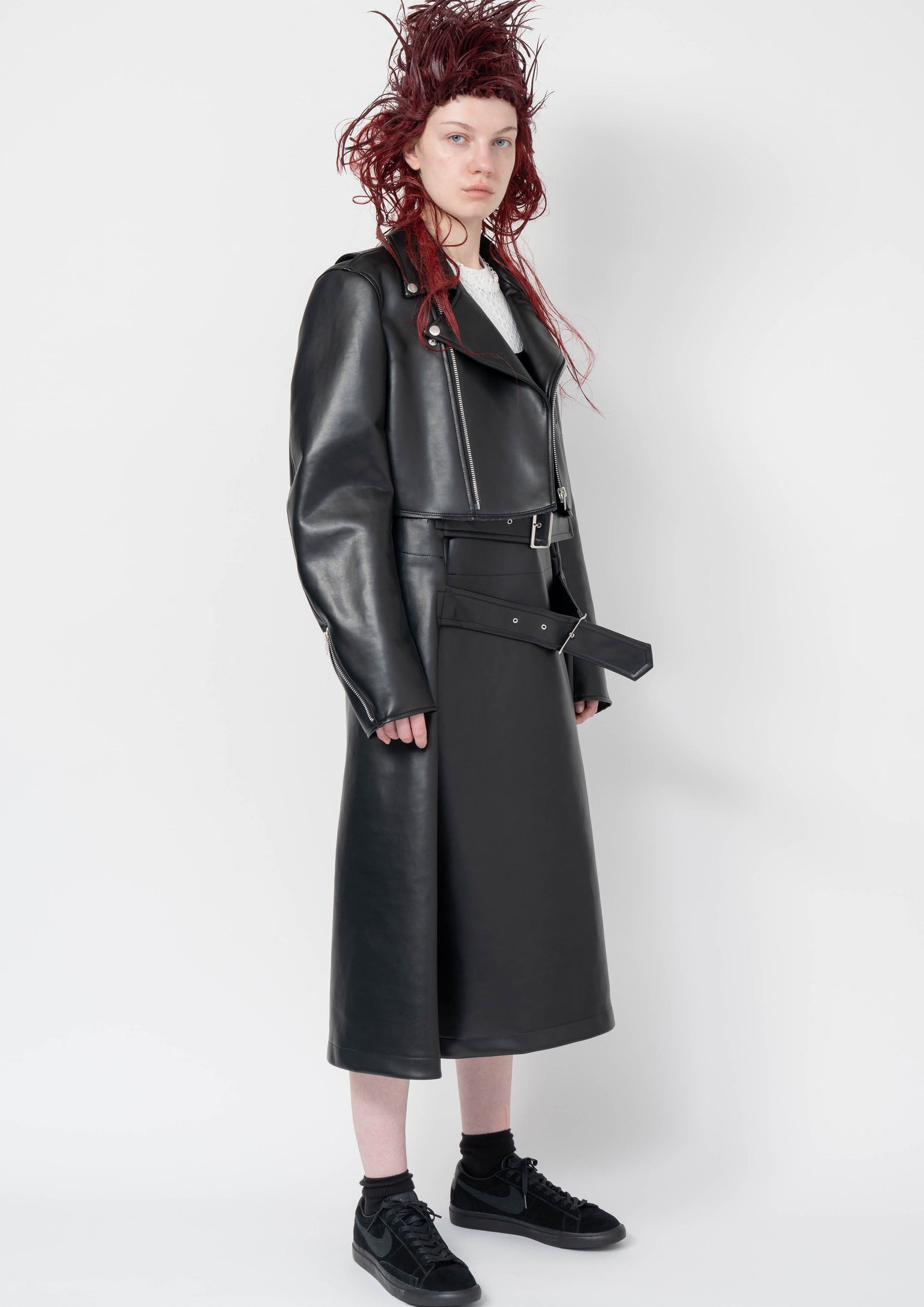 Fashion model wearing a Black Comme des Garçons AW25 outfit