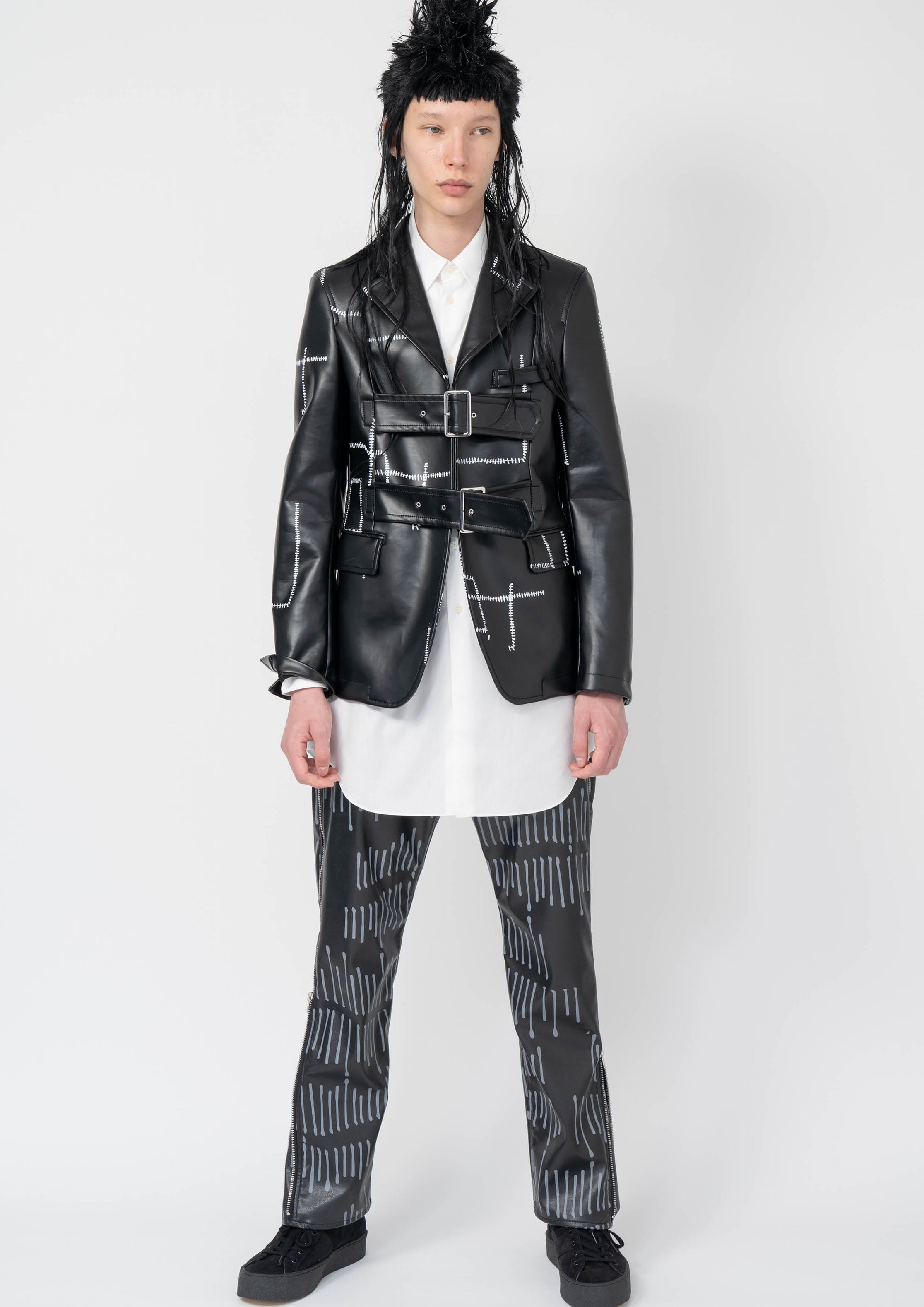 Fashion model wearing a Black Comme des Garçons AW25 outfit