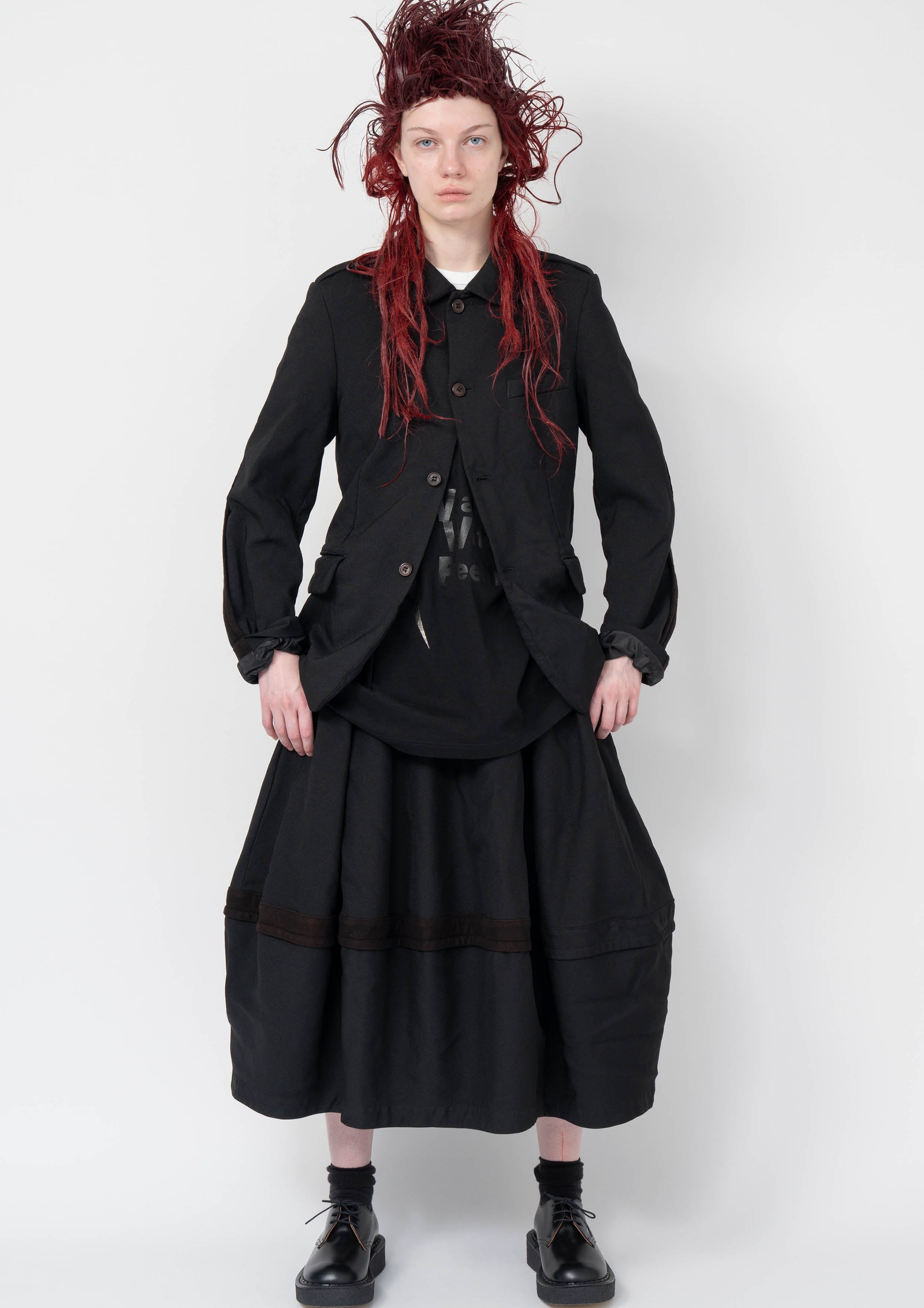 Fashion model wearing a Black Comme des Garçons AW25 outfit