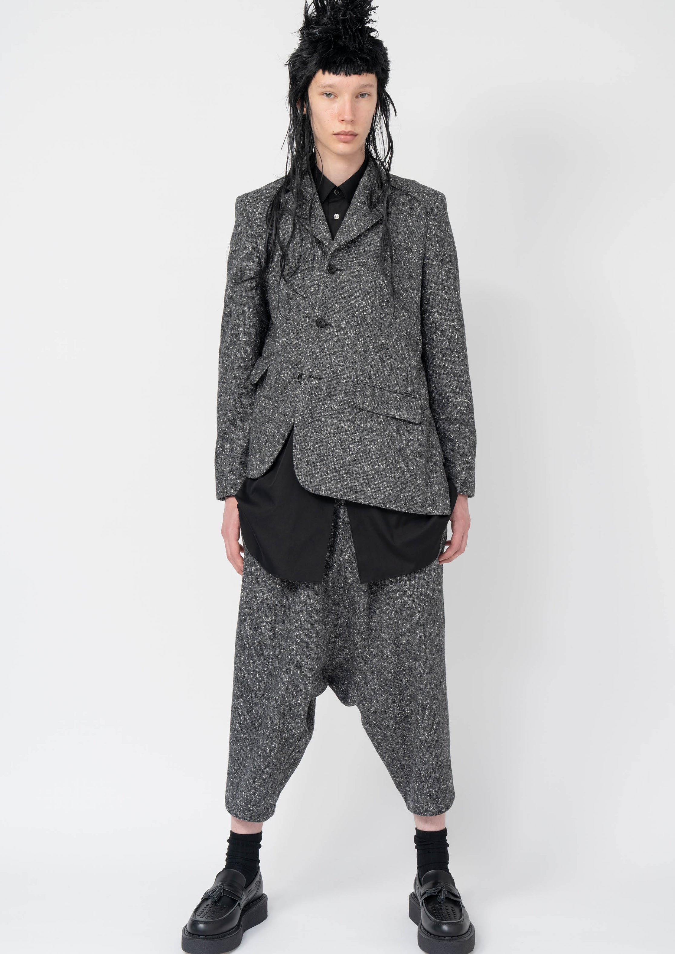 Fashion model wearing a Black Comme des Garçons AW25 outfit