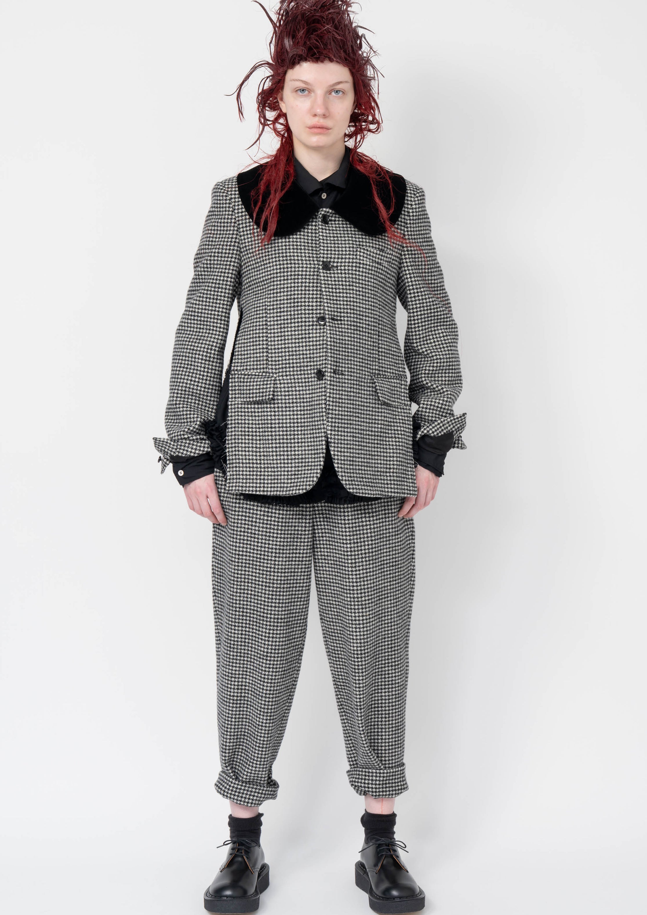 Fashion model wearing a Black Comme des Garçons AW25 outfit