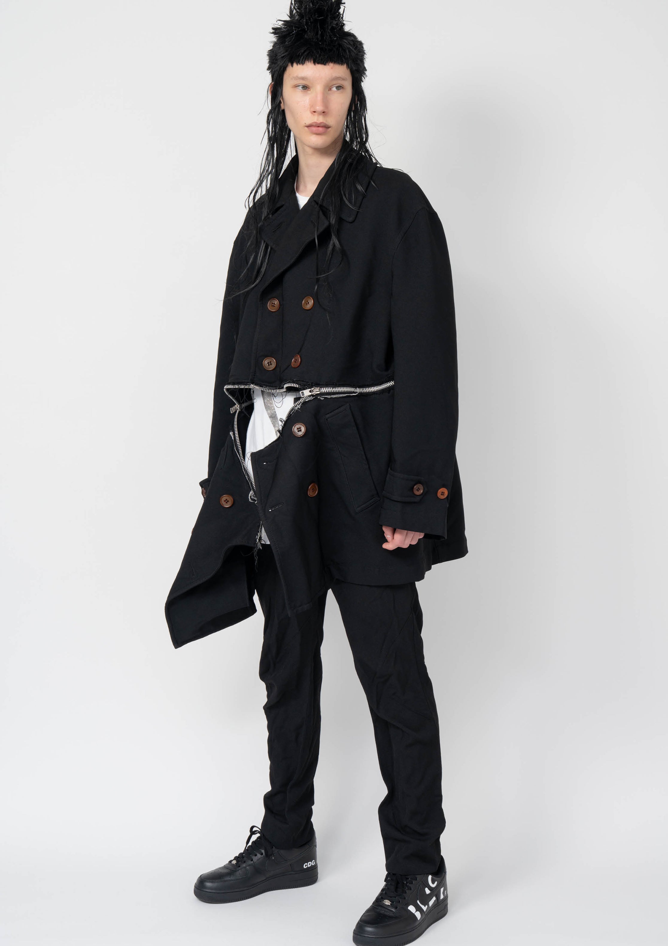 Fashion model wearing a Black Comme des Garçons AW25 outfit