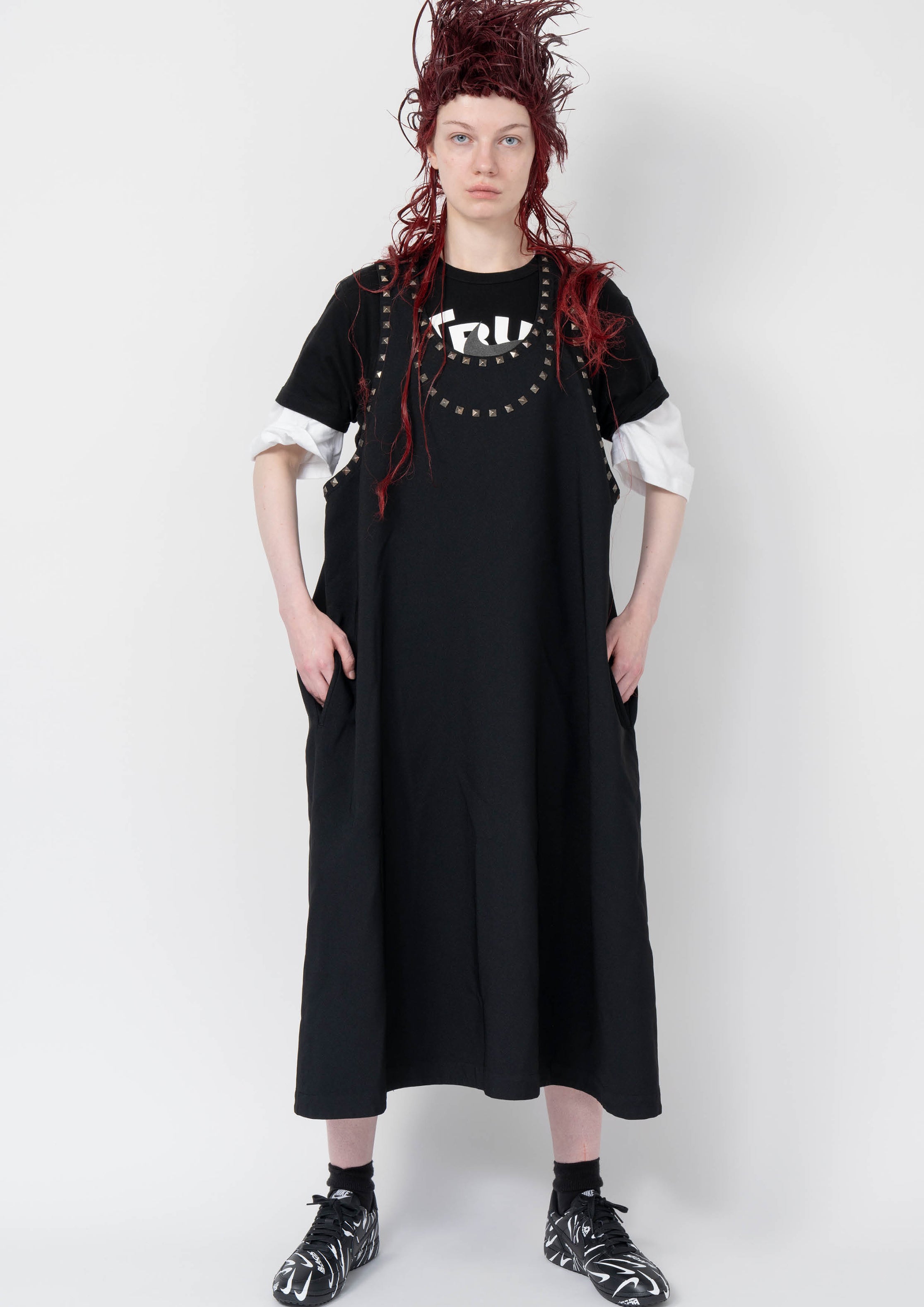 Fashion model wearing a Black Comme des Garçons AW25 outfit
