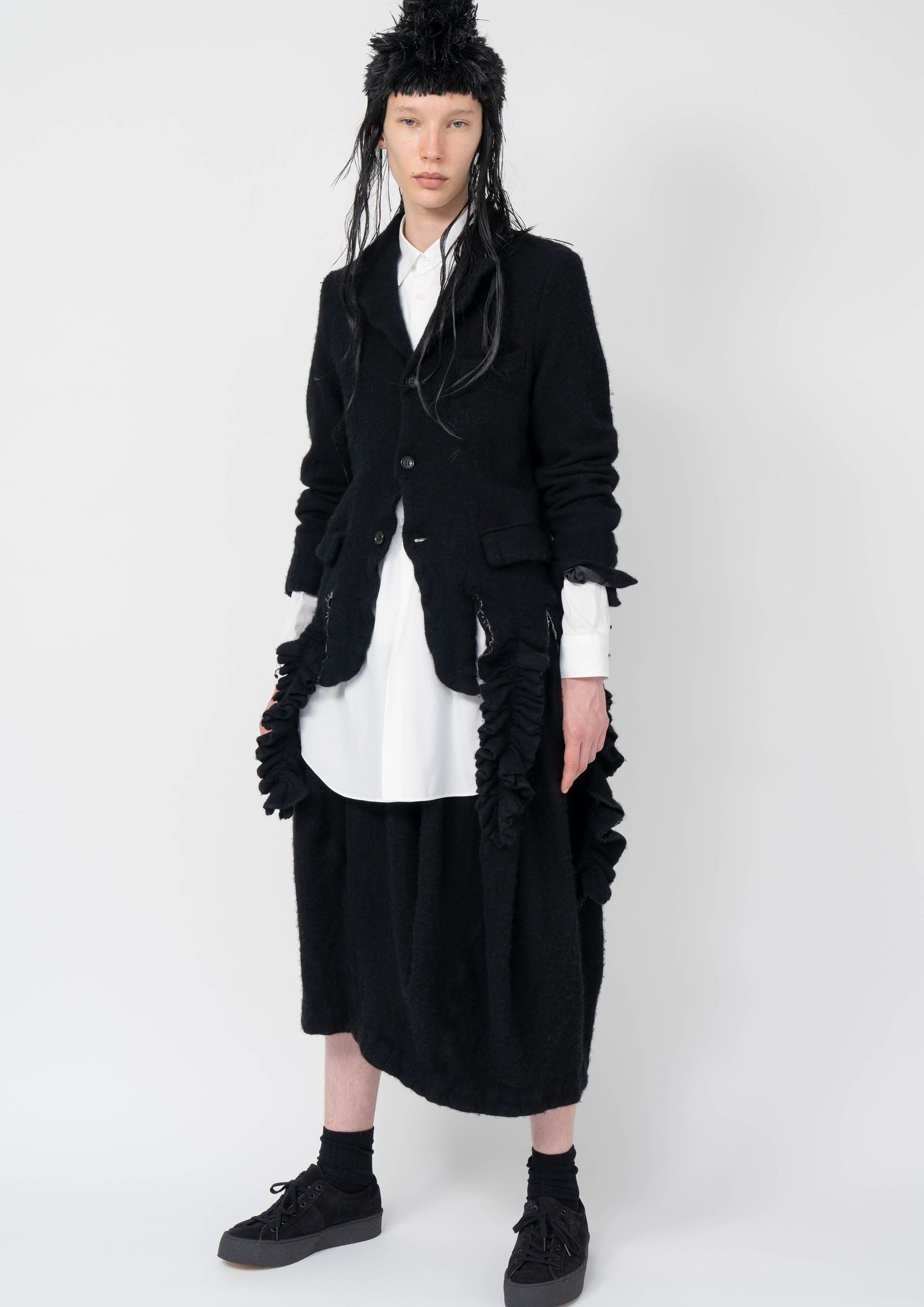 Fashion model wearing a Black Comme des Garçons AW25 outfit