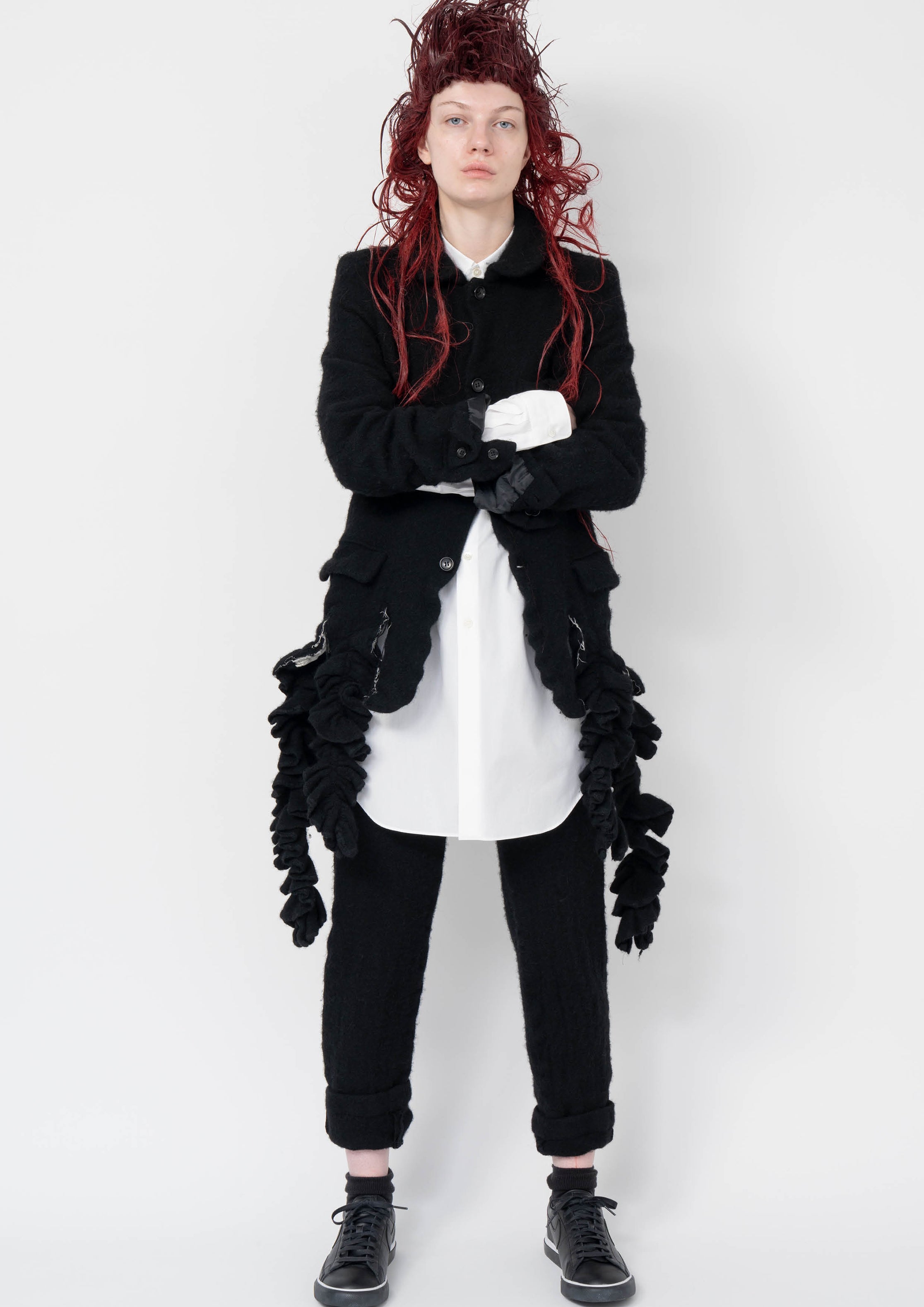 Fashion model wearing a Black Comme des Garçons AW25 outfit