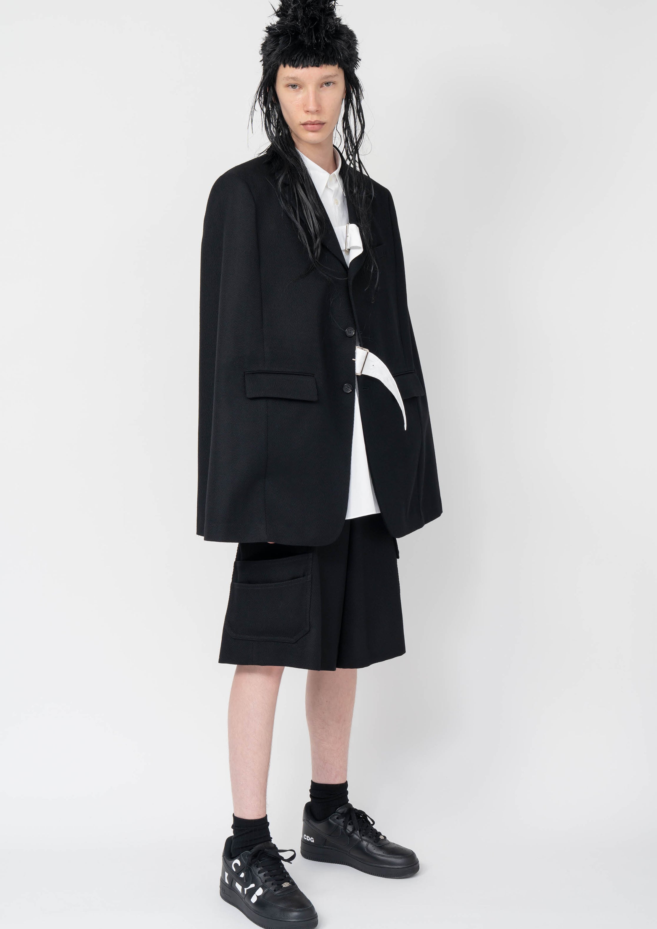 Fashion model wearing a Black Comme des Garçons AW25 outfit