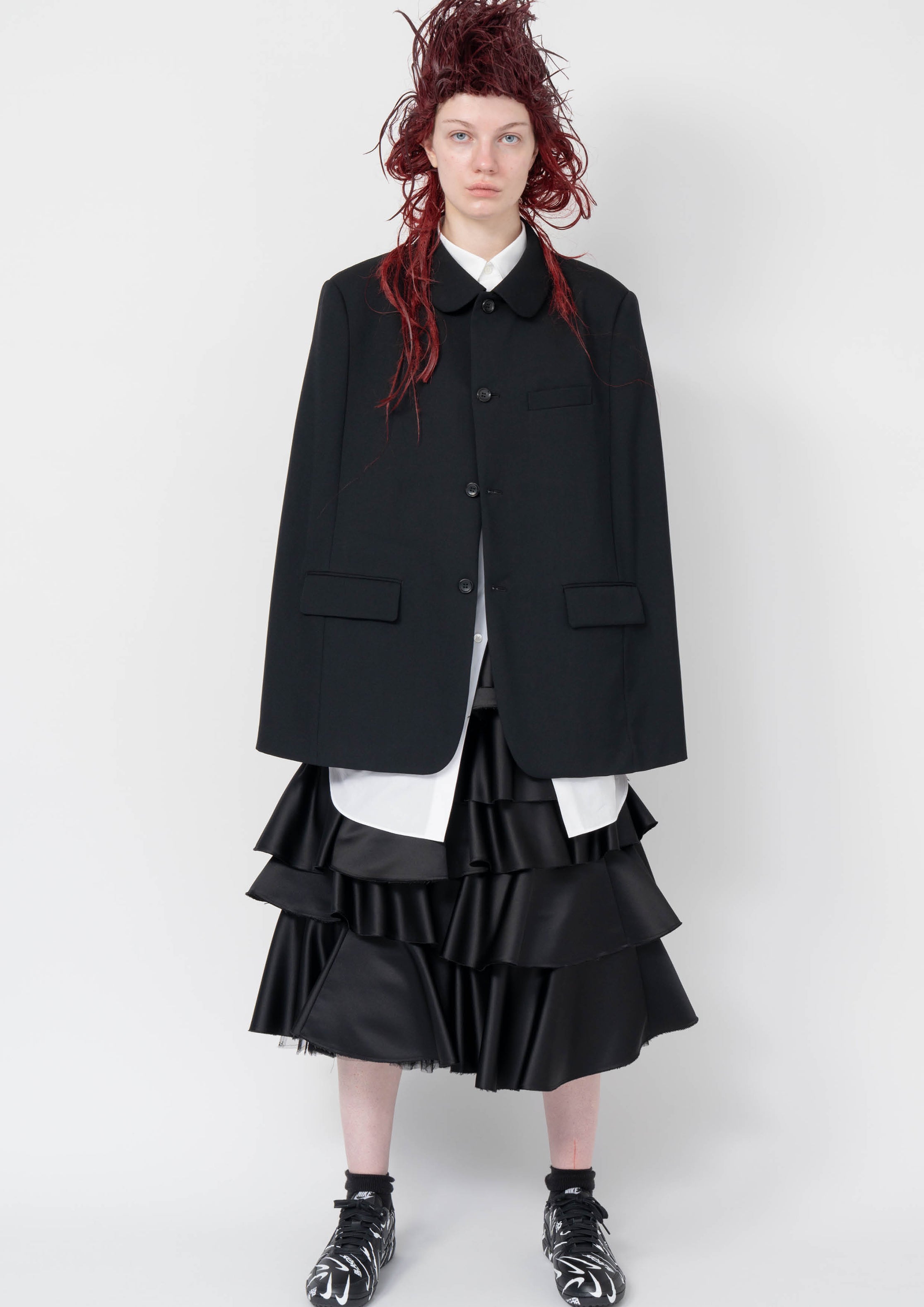 Fashion model wearing a Black Comme des Garçons AW25 outfit