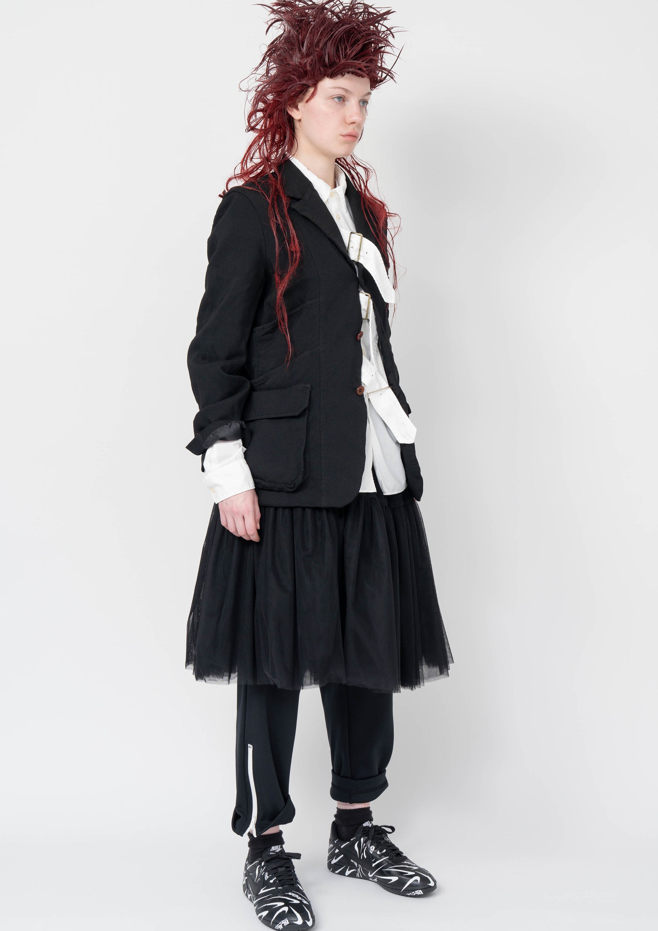 Fashion model wearing a Black Comme des Garçons AW25 outfit