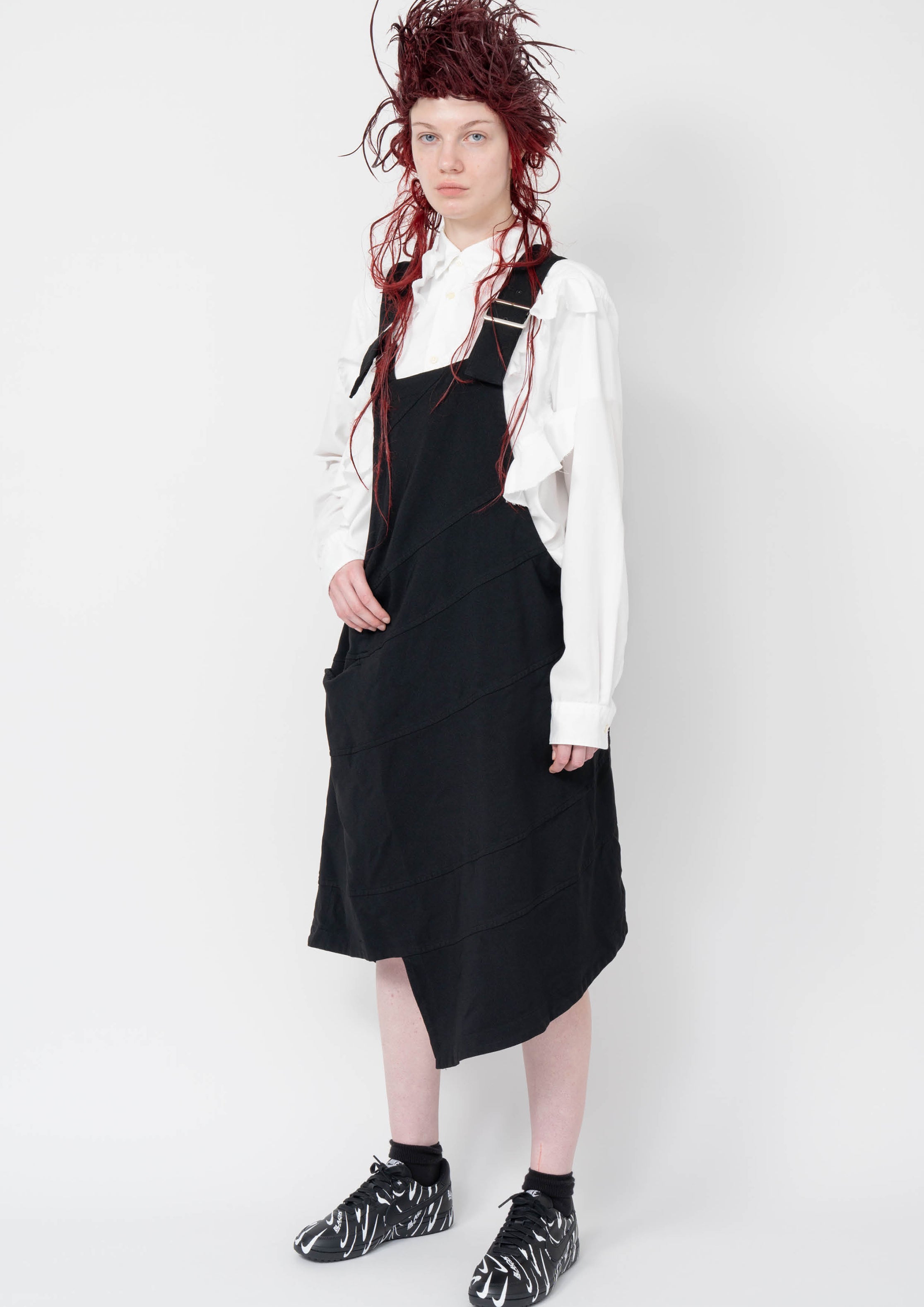 Fashion model wearing a Black Comme des Garçons AW25 outfit