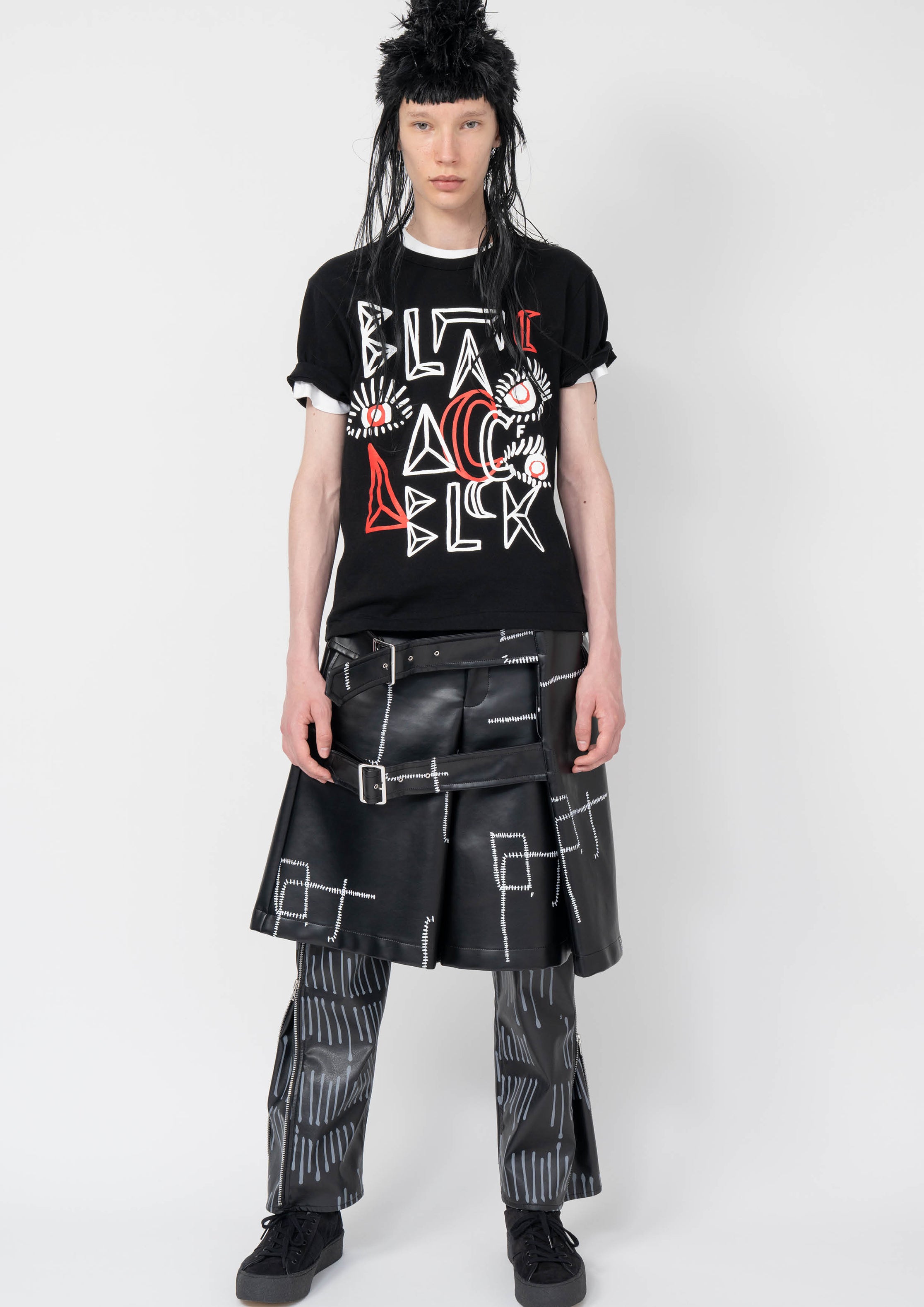 Fashion model wearing a Black Comme des Garçons AW25 outfit