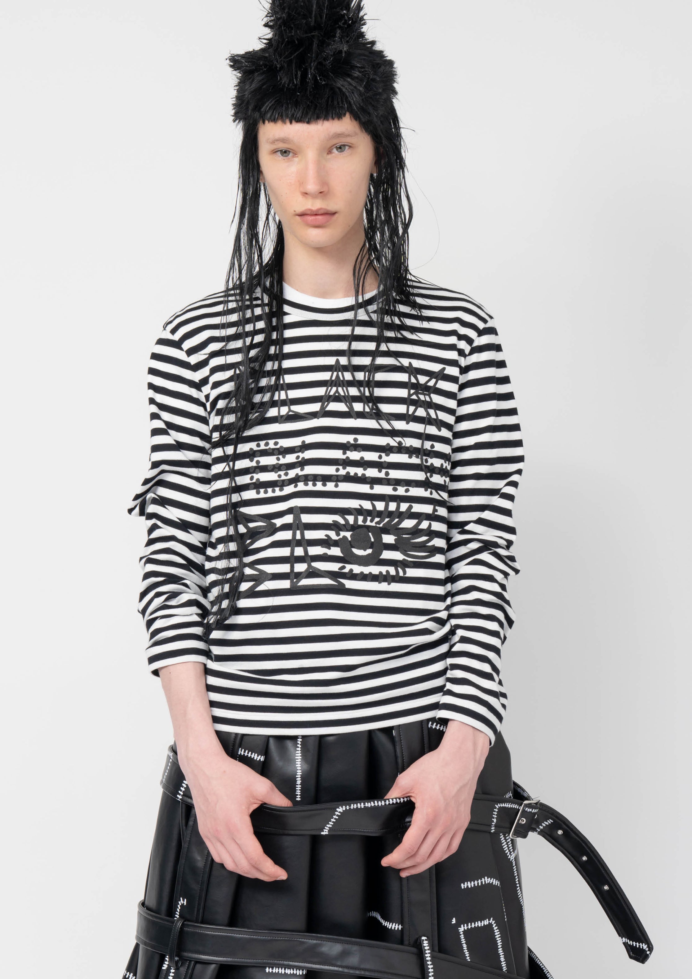 Fashion model wearing a Black Comme des Garçons AW25 outfit
