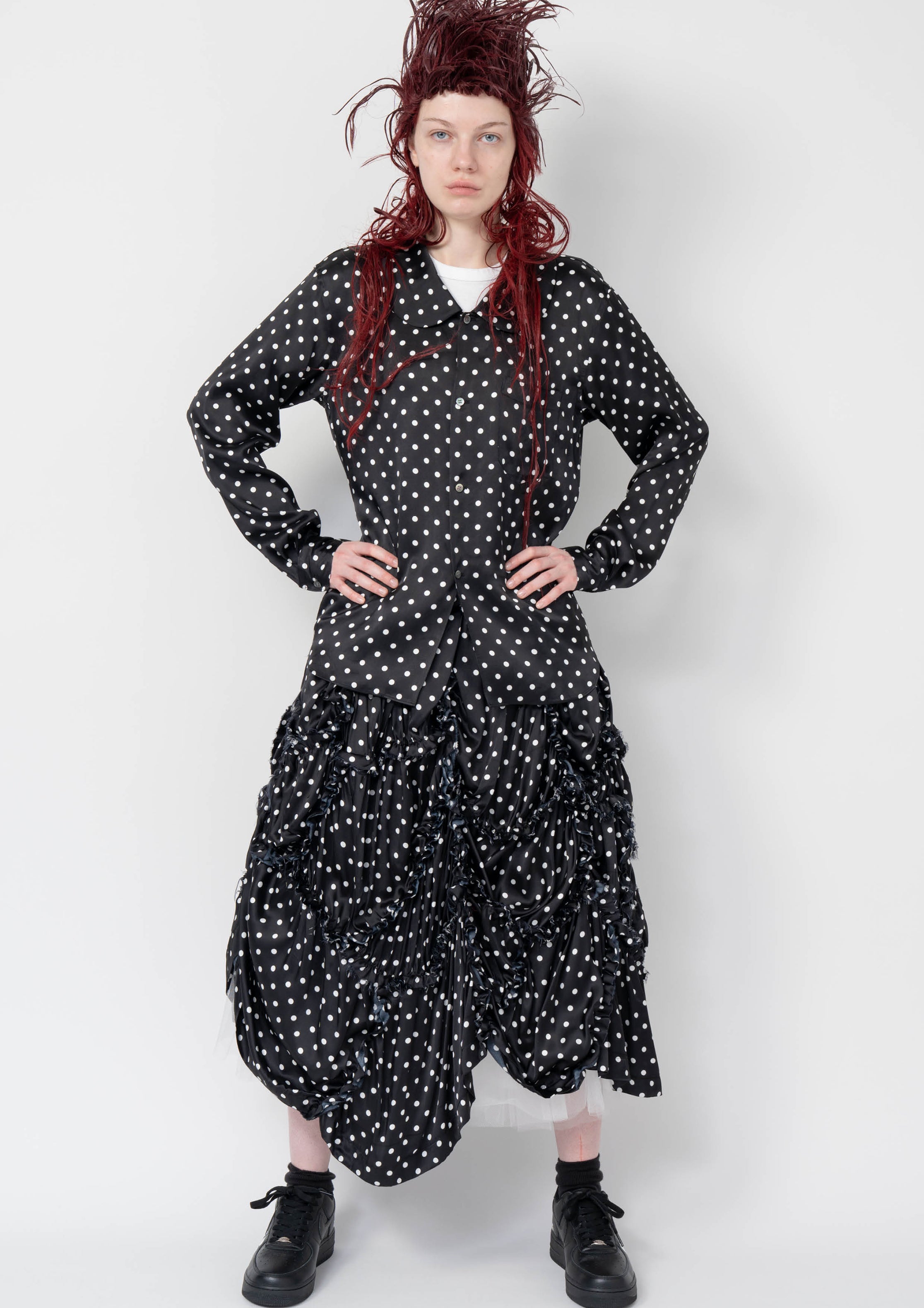 Fashion model wearing a Black Comme des Garçons AW25 outfit