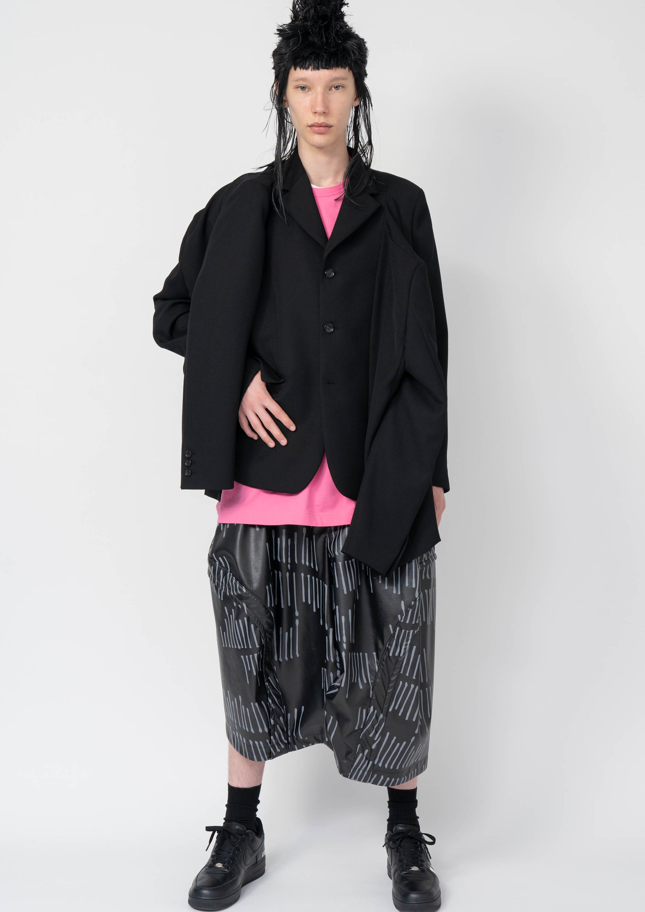 Fashion model wearing a Black Comme des Garçons AW25 outfit