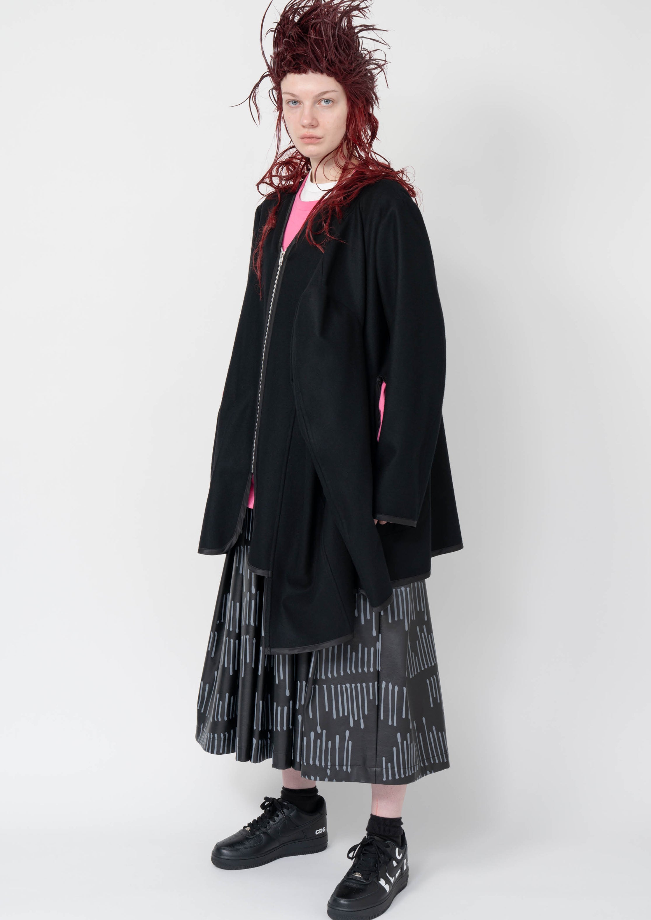 Fashion model wearing a Black Comme des Garçons AW25 outfit