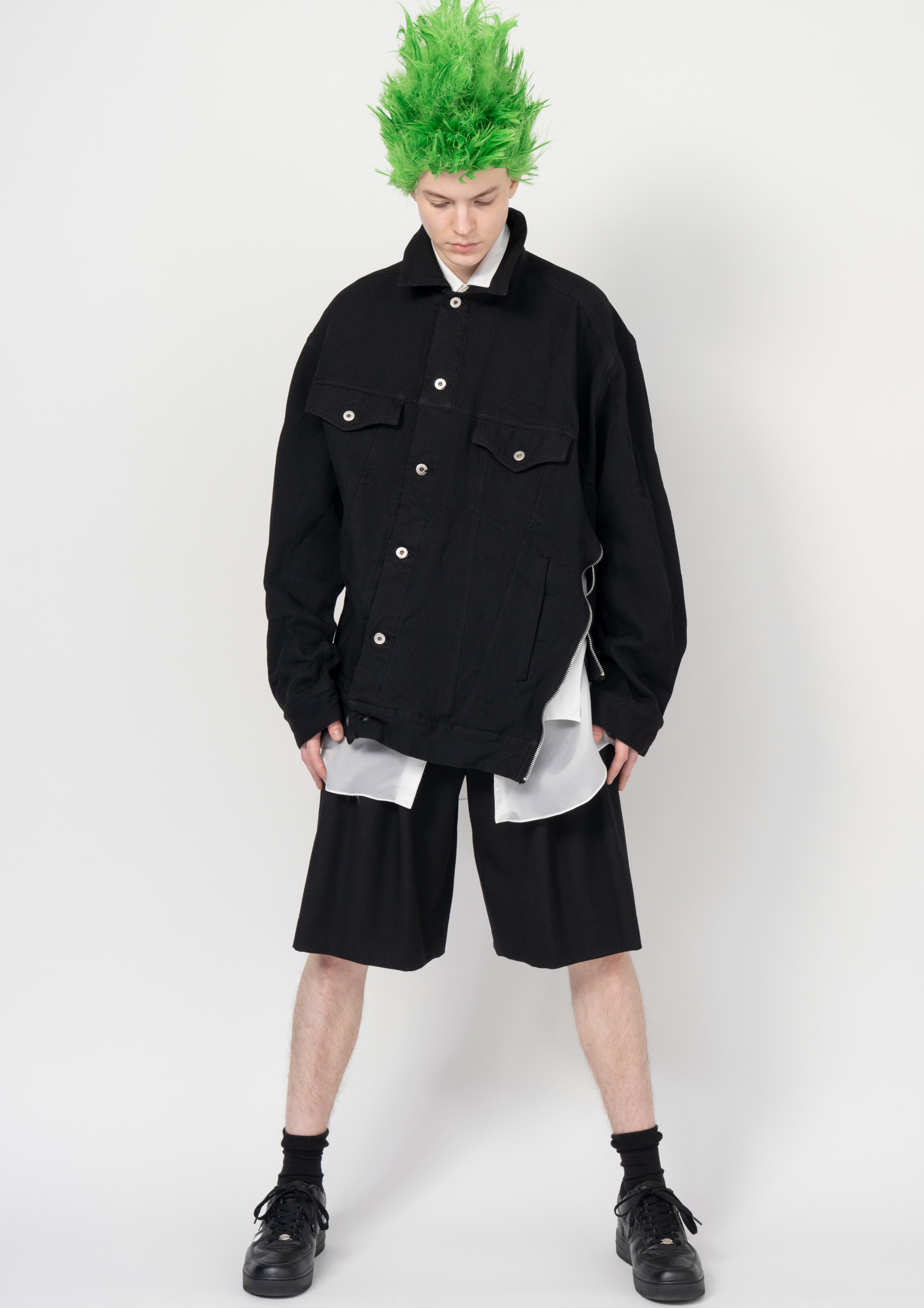 Fashion model wearing a Black Comme des Garçons SS26 outfit