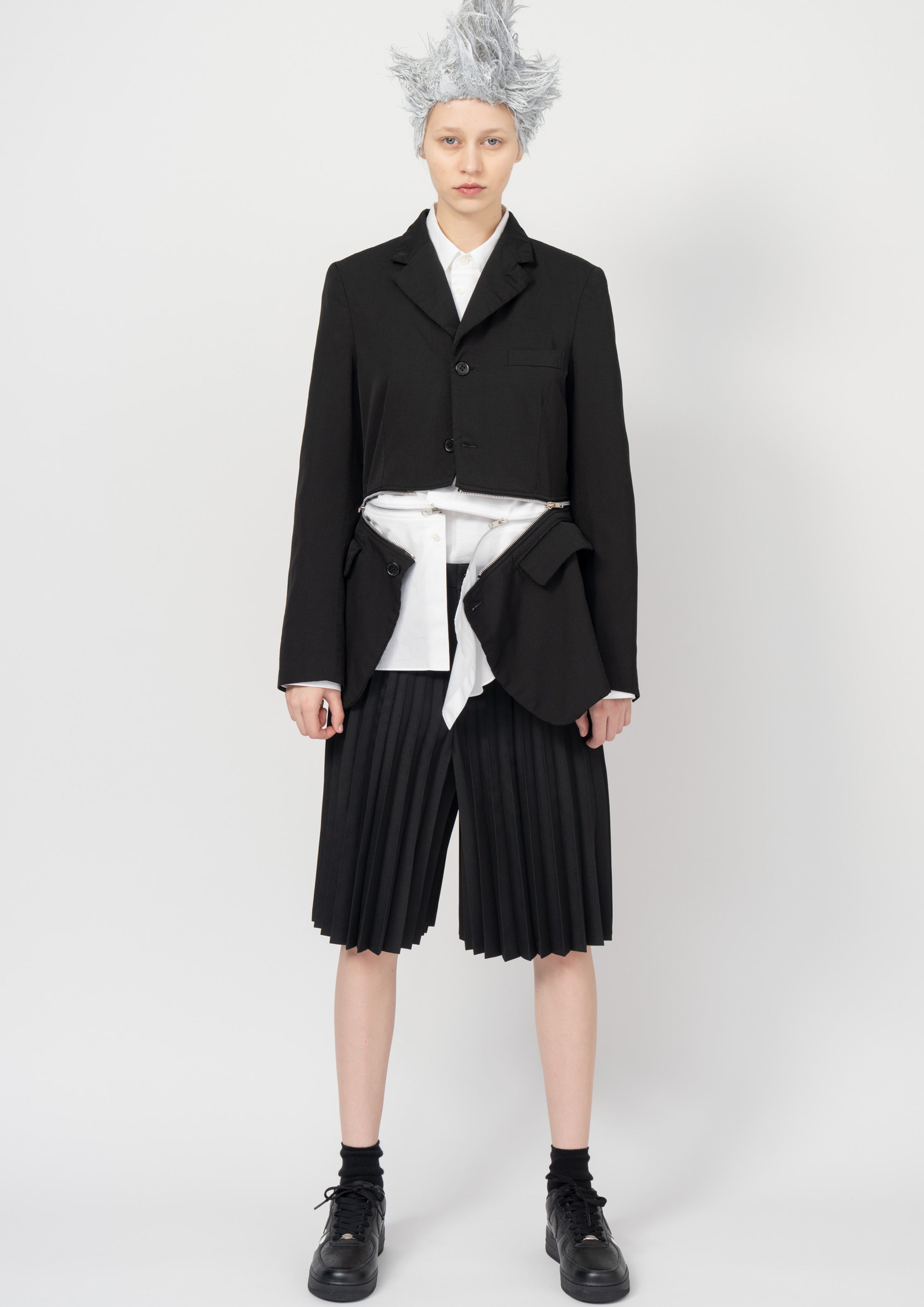 Fashion model wearing a Black Comme des Garçons SS26 outfit