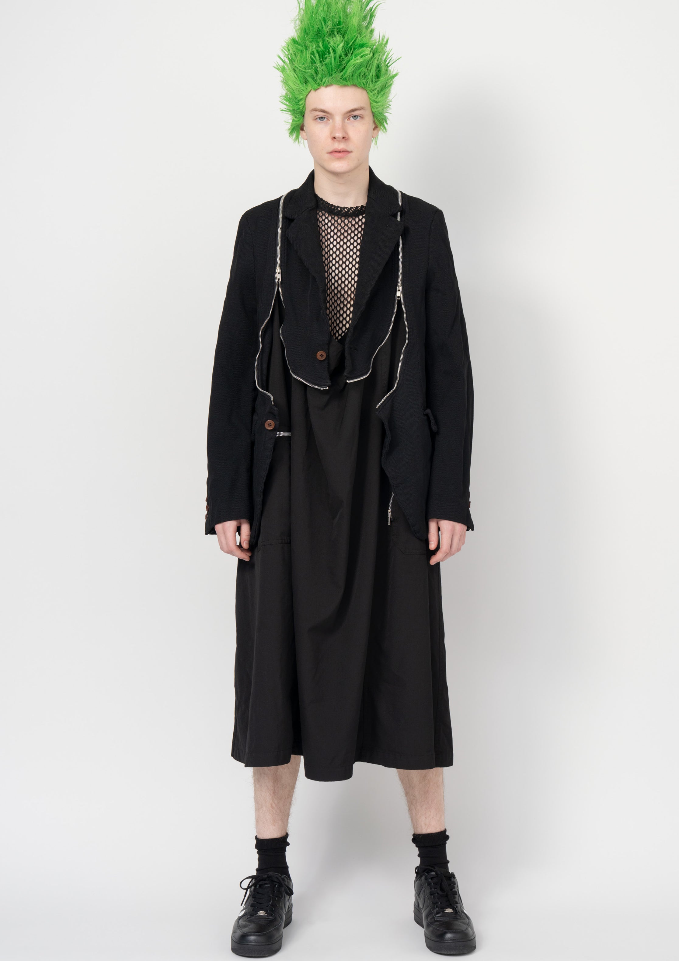 Fashion model wearing a Black Comme des Garçons SS26 outfit