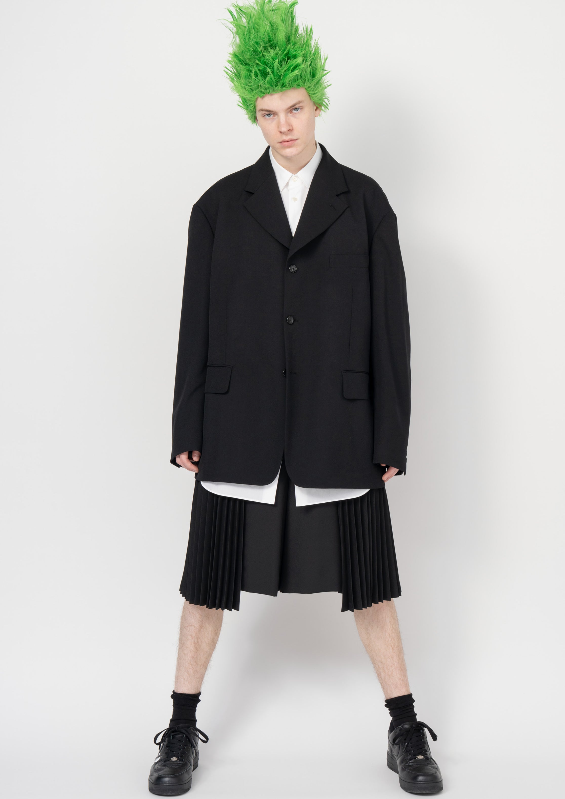 Fashion model wearing a Black Comme des Garçons SS26 outfit