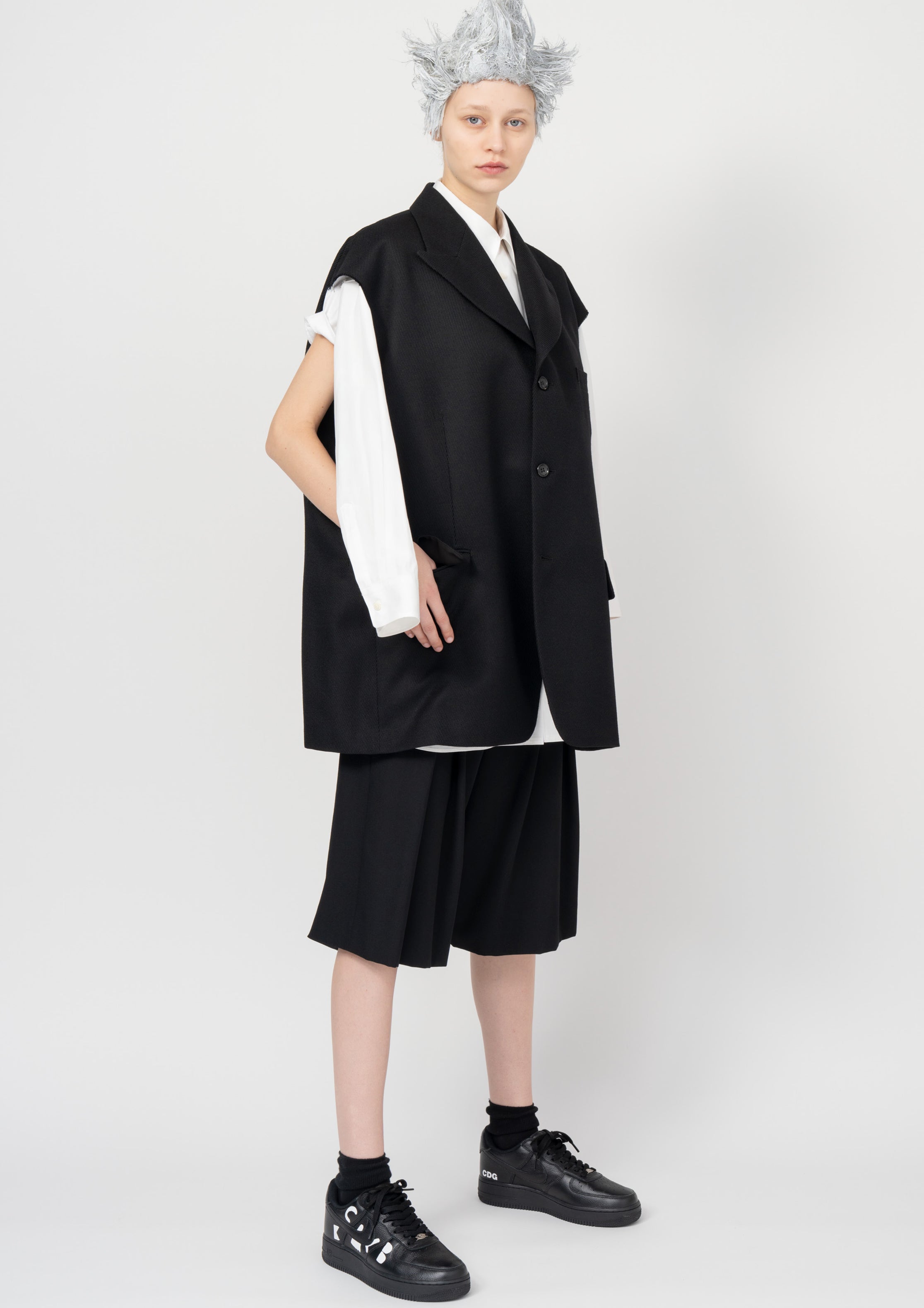 Fashion model wearing a Black Comme des Garçons SS26 outfit