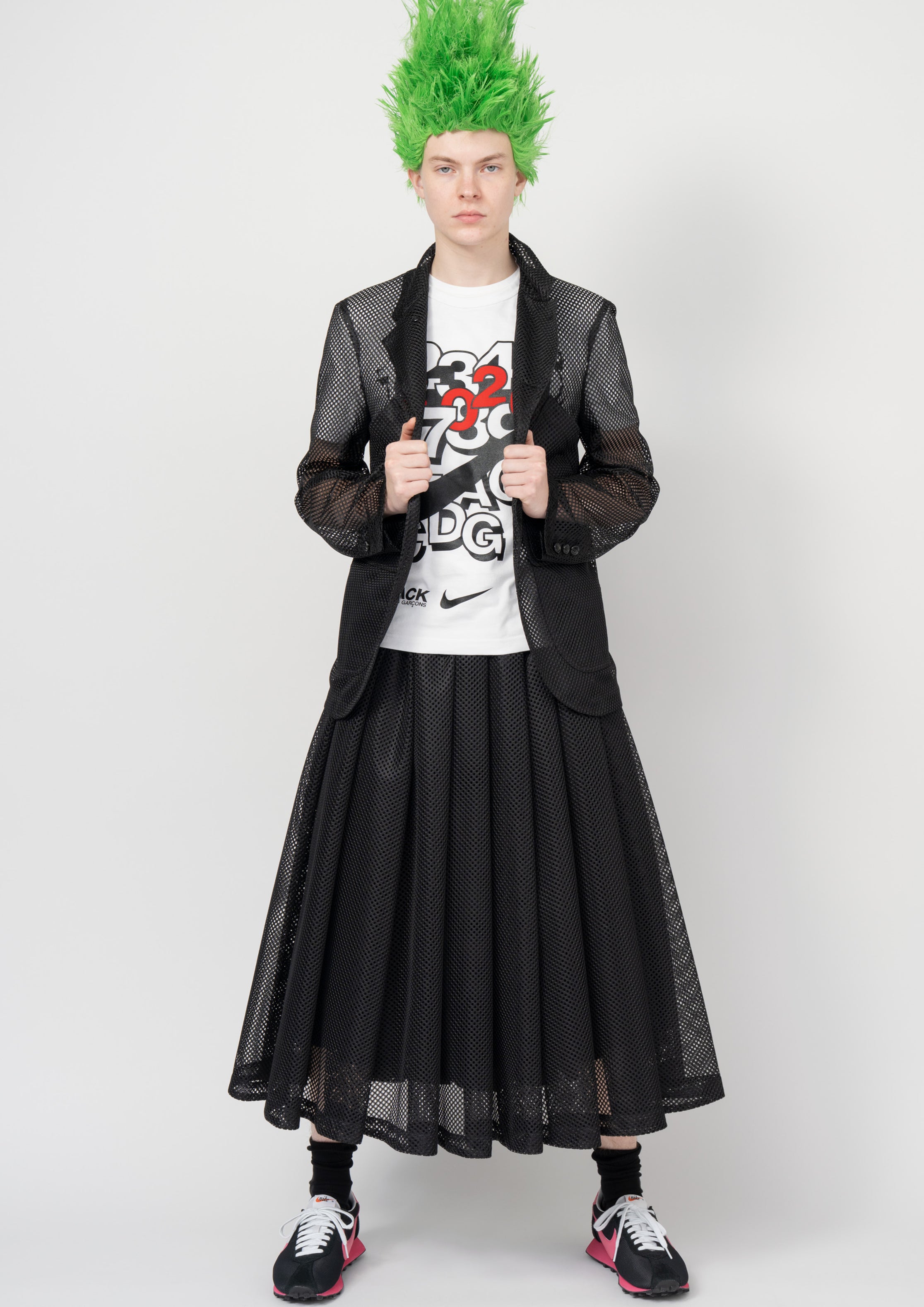 Fashion model wearing a Black Comme des Garçons SS26 outfit
