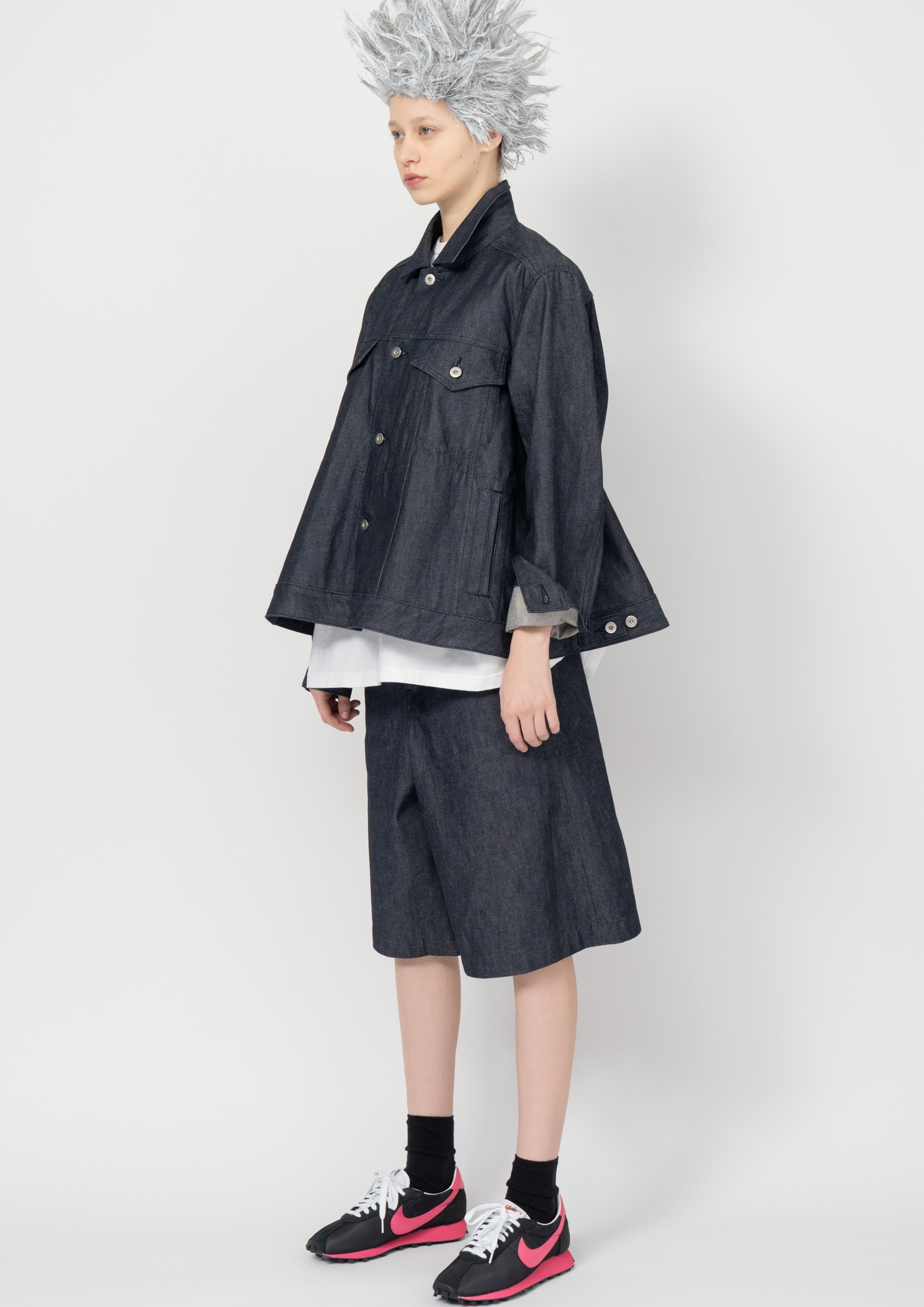 Fashion model wearing a Black Comme des Garçons SS26 outfit