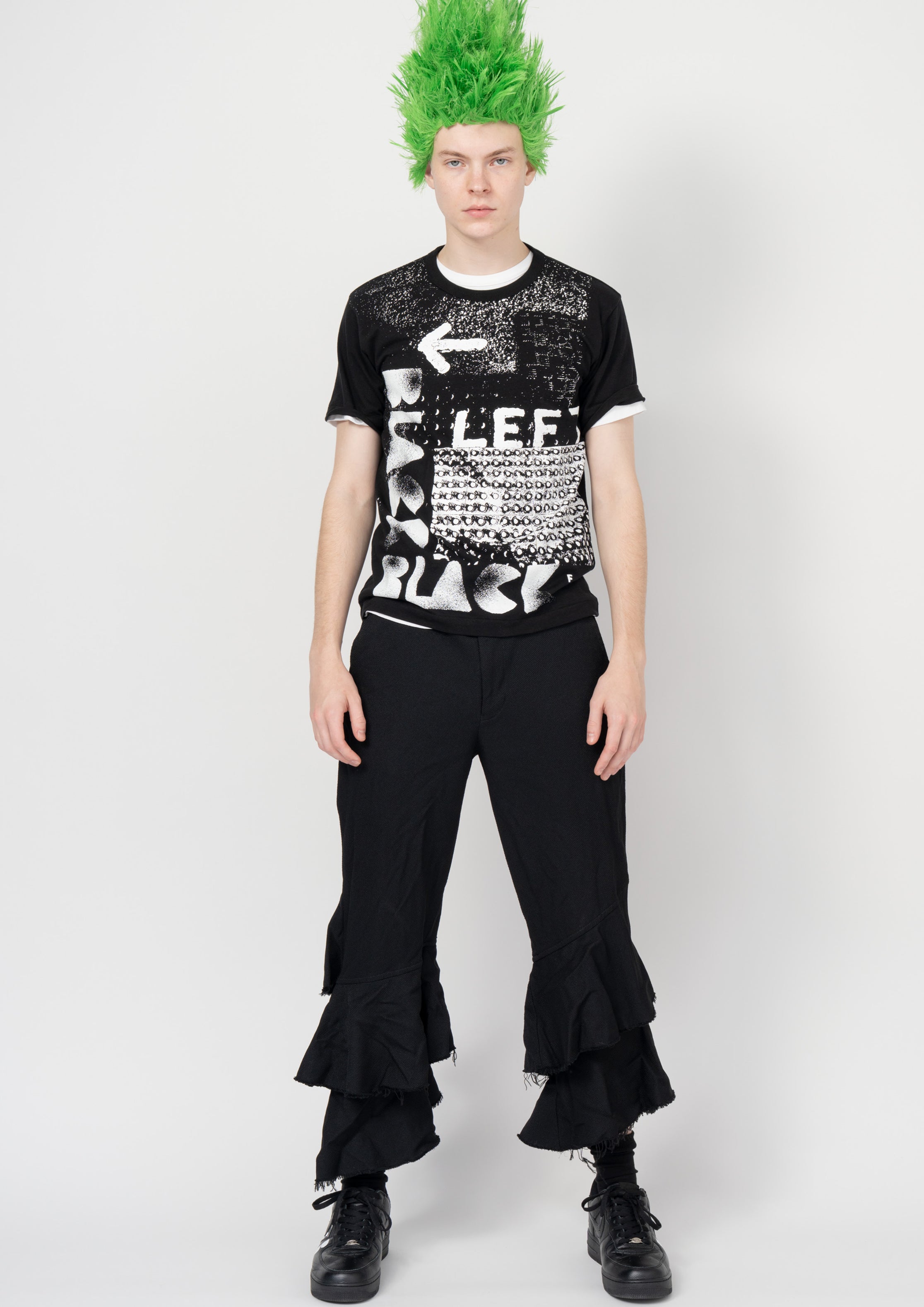 Fashion model wearing a Black Comme des Garçons SS26 outfit