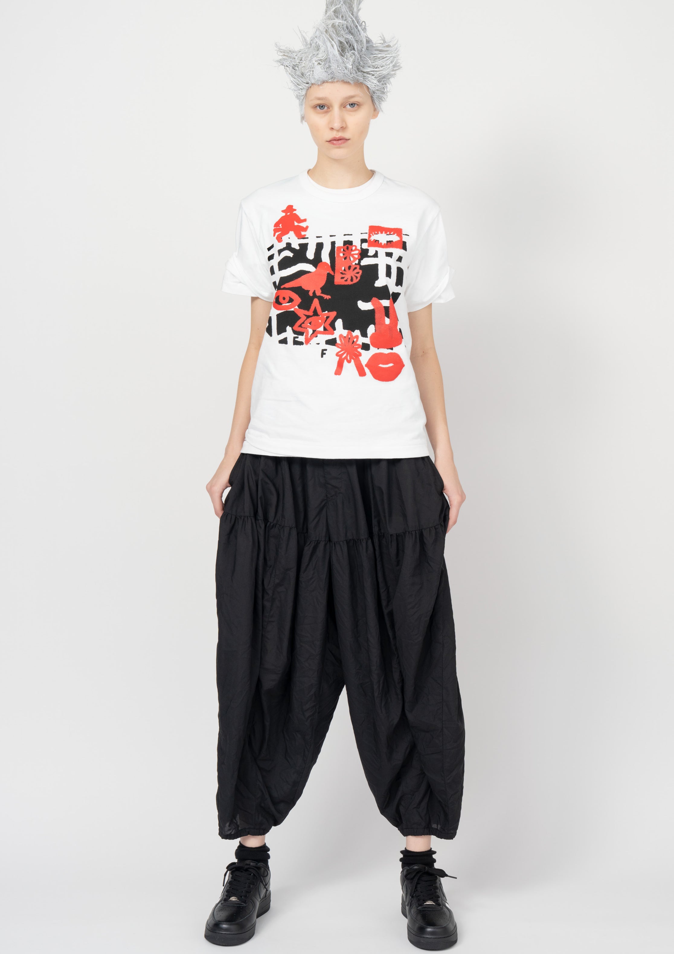 Fashion model wearing a Black Comme des Garçons SS26 outfit