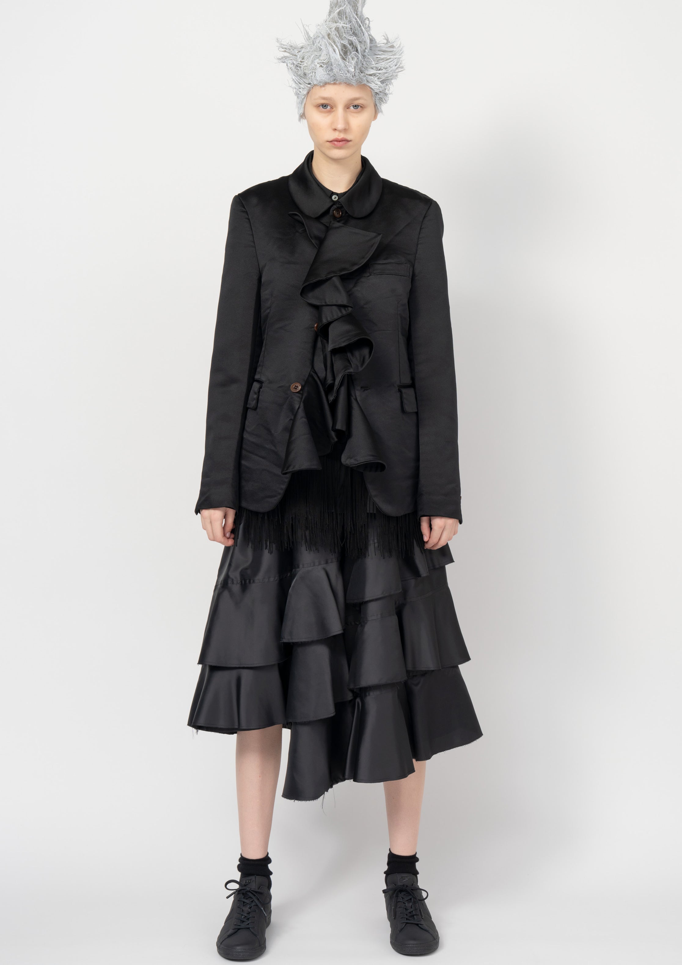 Fashion model wearing a Black Comme des Garçons SS26 outfit