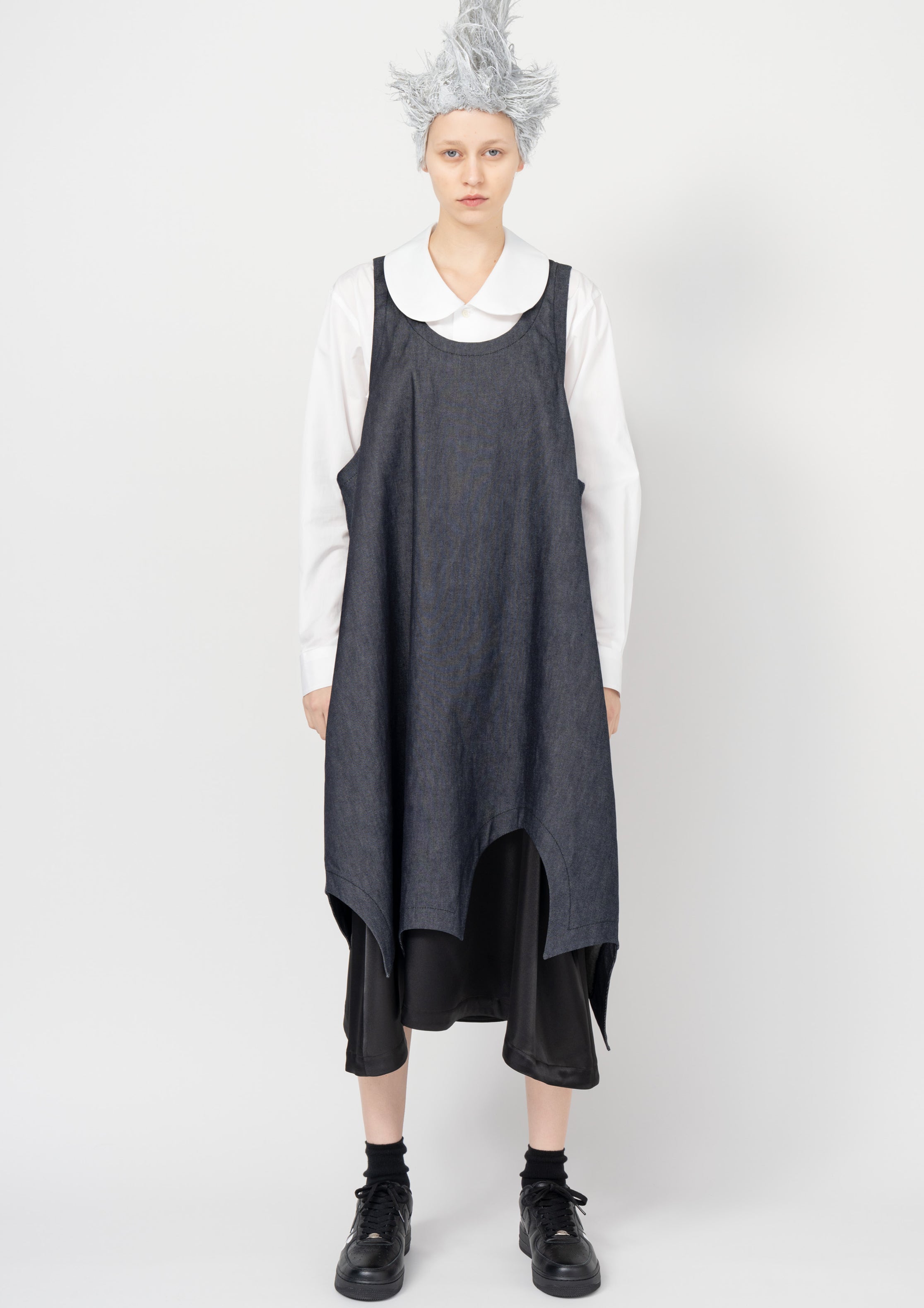 Fashion model wearing a Black Comme des Garçons SS26 outfit