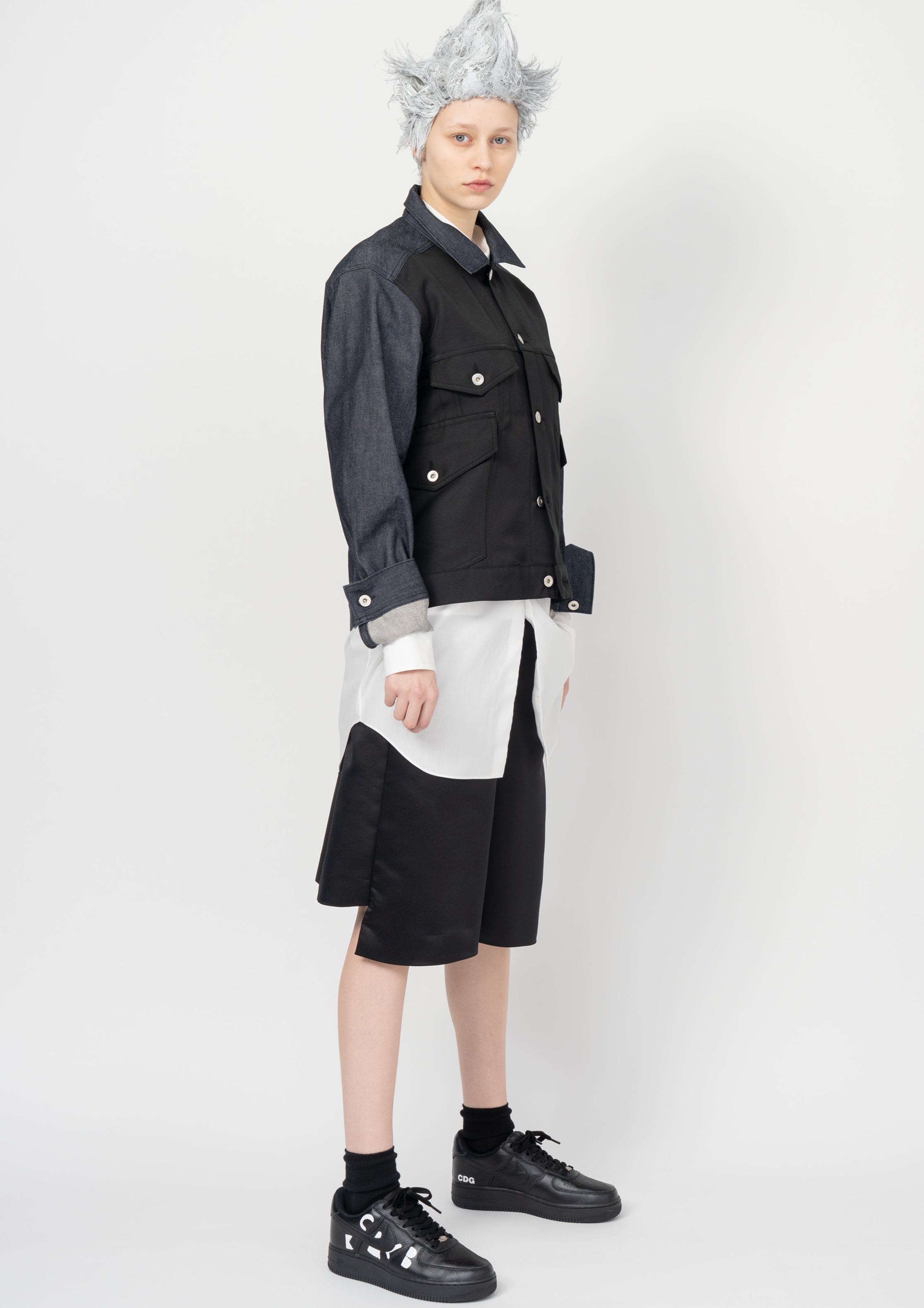 Fashion model wearing a Black Comme des Garçons SS26 outfit