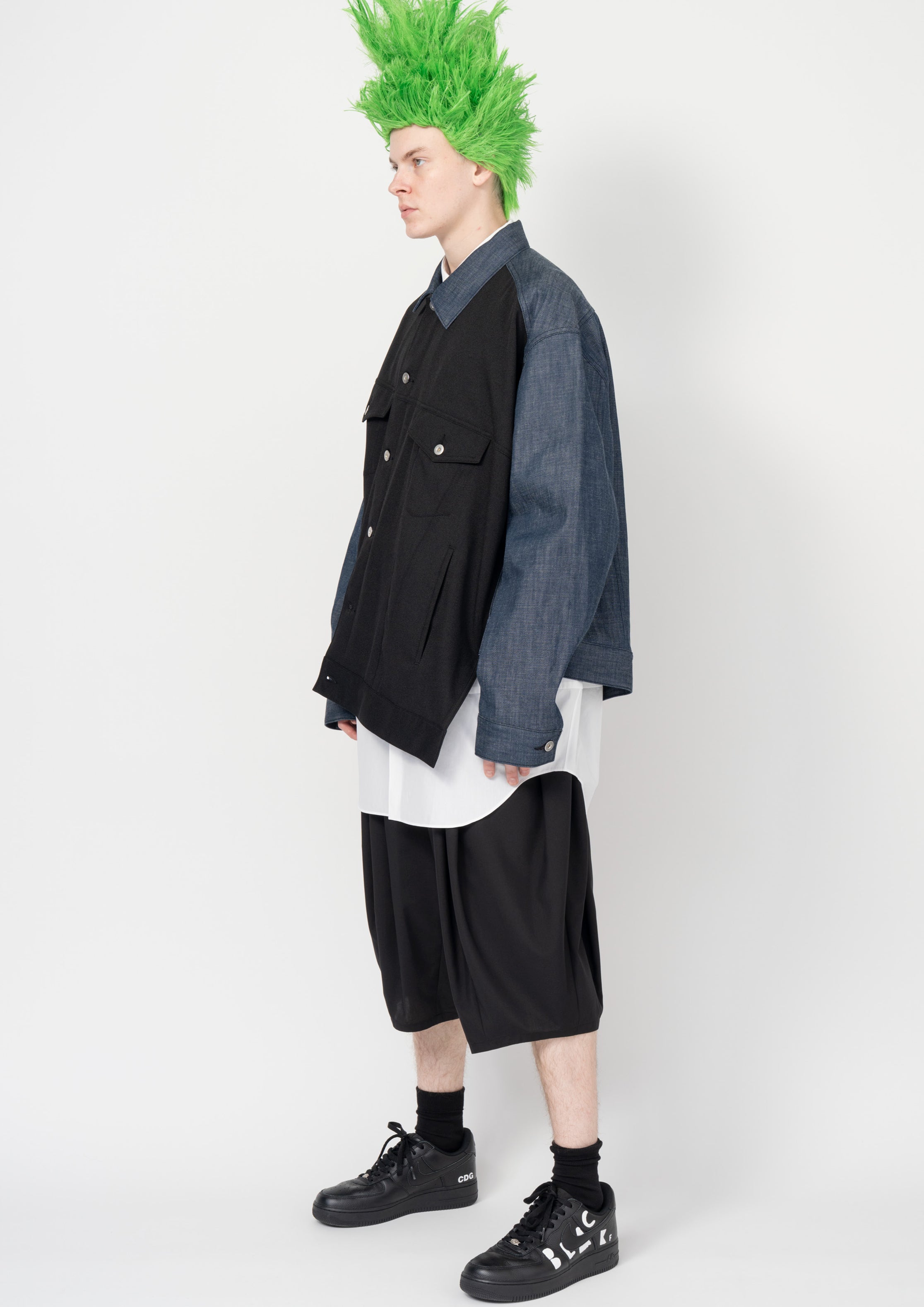 Fashion model wearing a Black Comme des Garçons SS26 outfit