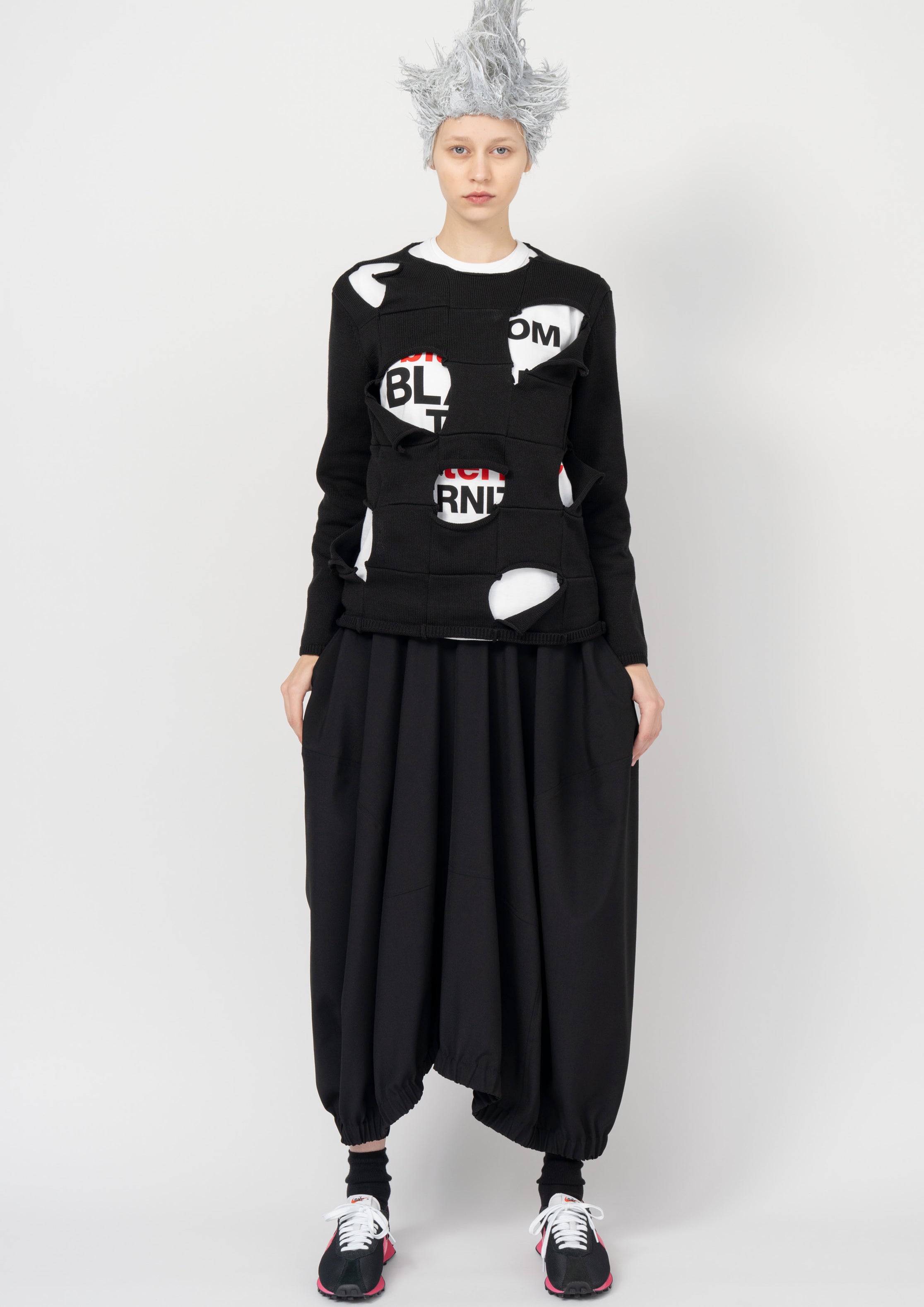Fashion model wearing a Black Comme des Garçons SS26 outfit