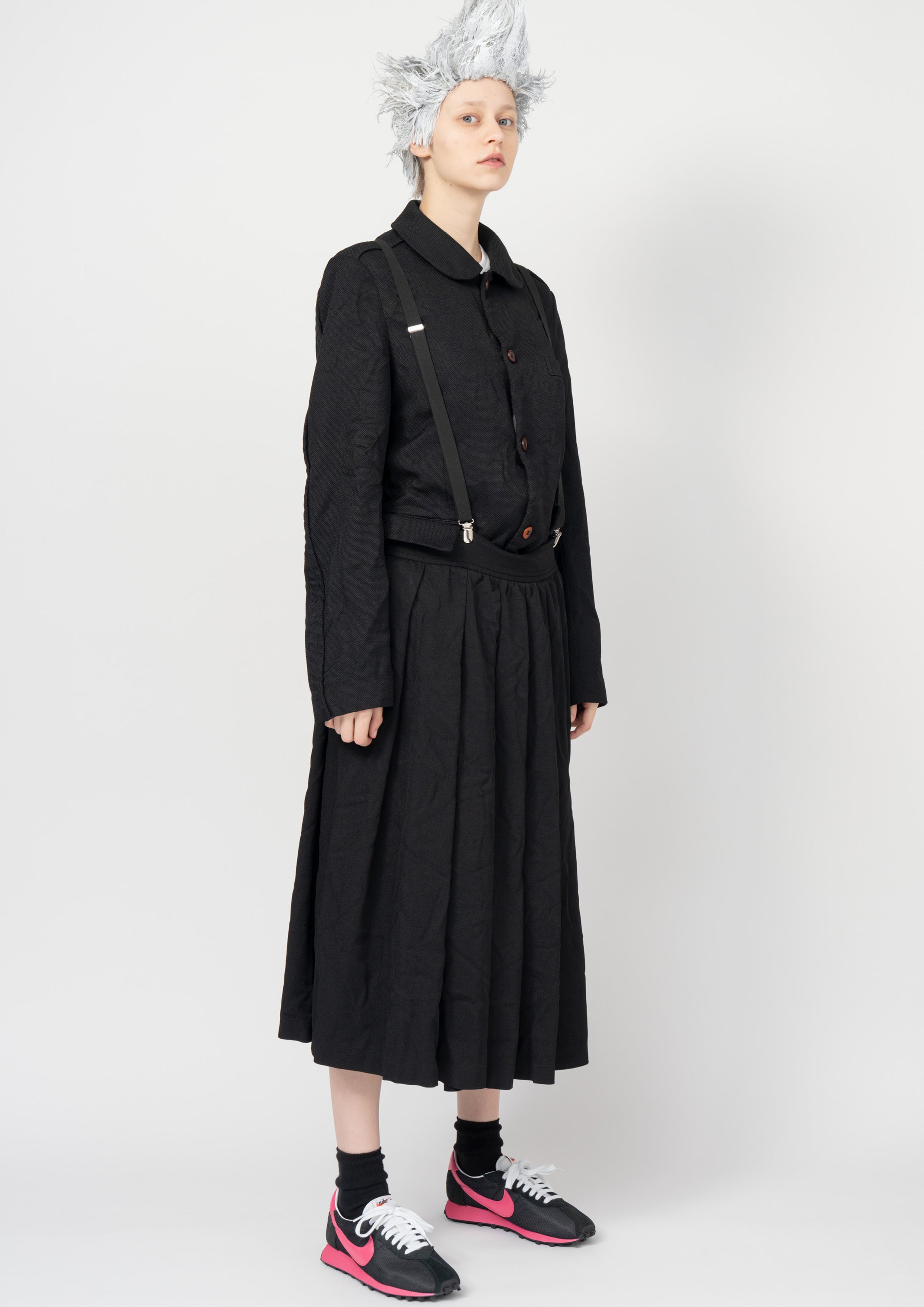 Fashion model wearing a Black Comme des Garçons SS26 outfit