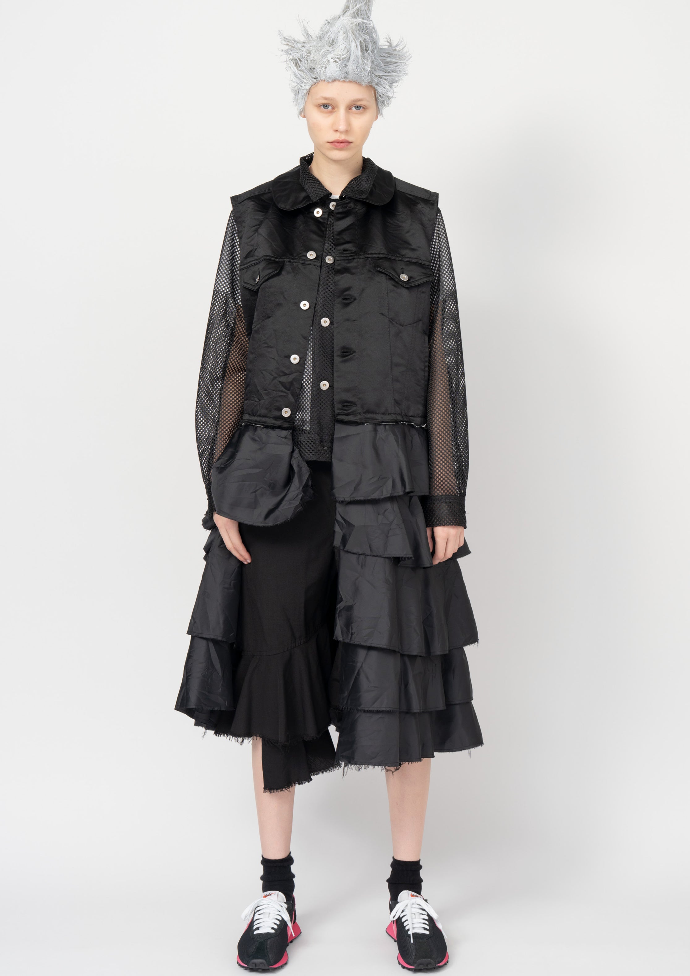 Fashion model wearing a Black Comme des Garçons SS26 outfit