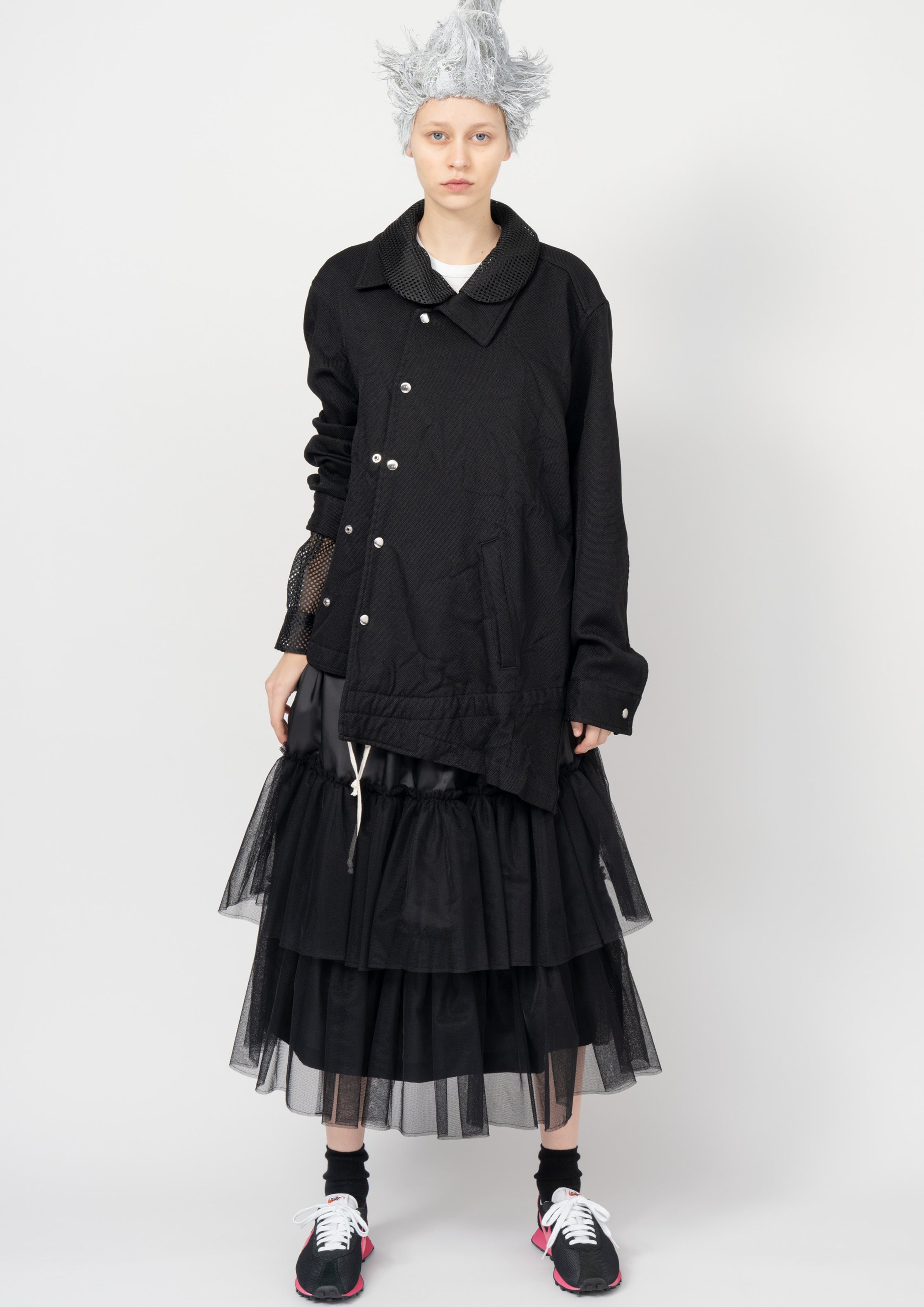 Fashion model wearing a Black Comme des Garçons SS26 outfit