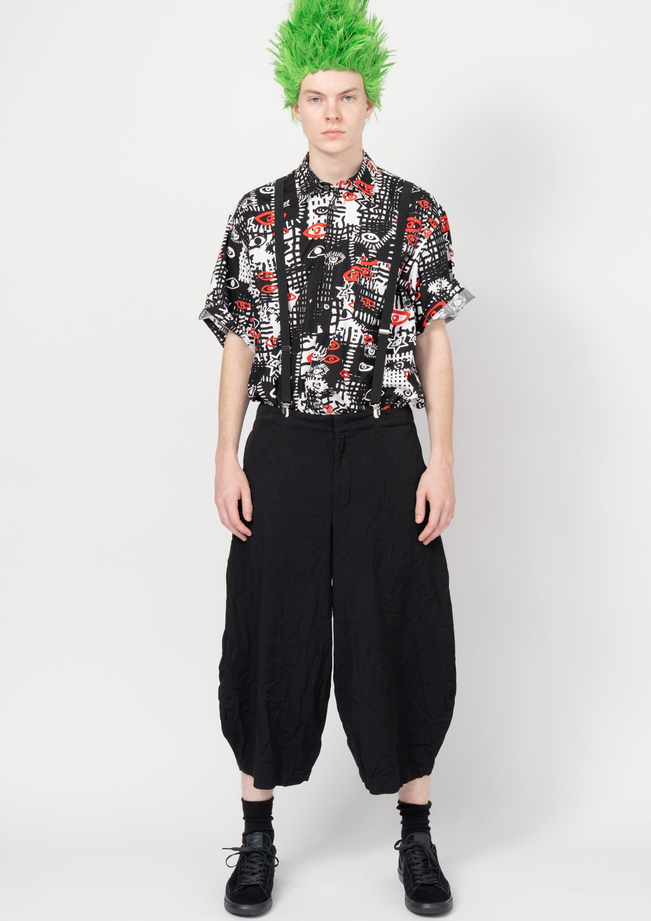 Fashion model wearing a Black Comme des Garçons SS26 outfit