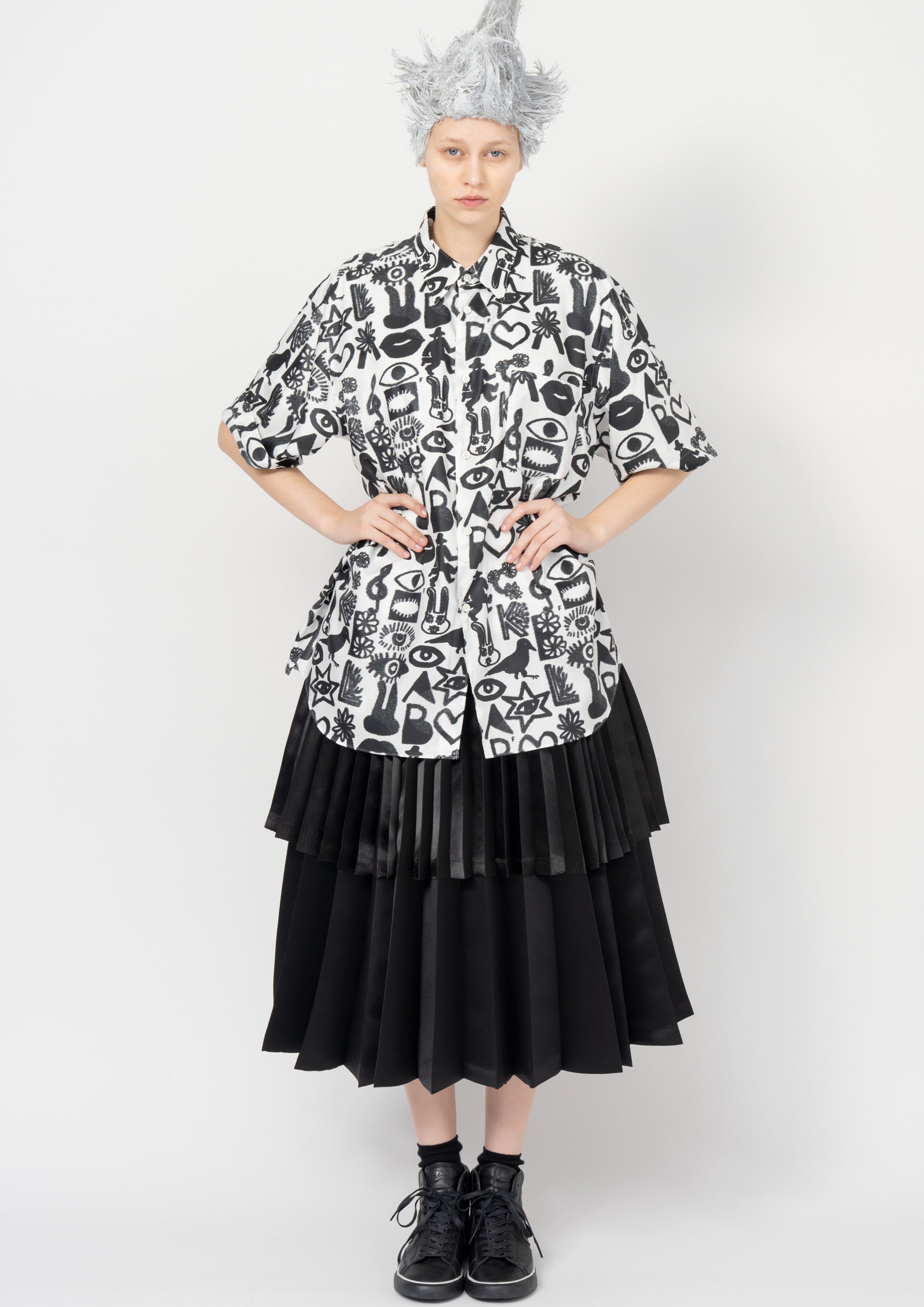 Fashion model wearing a Black Comme des Garçons SS26 outfit