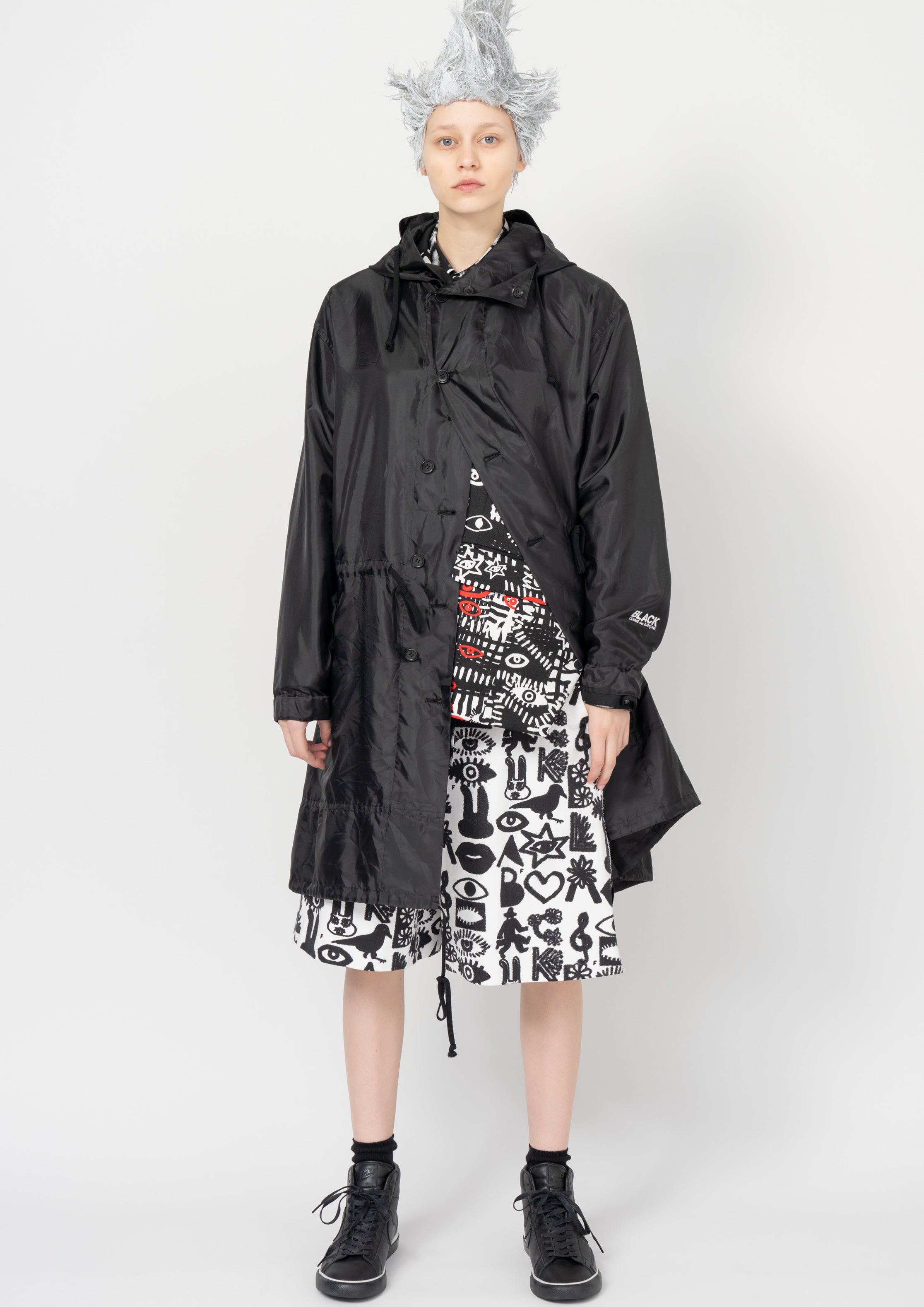 Fashion model wearing a Black Comme des Garçons SS26 outfit